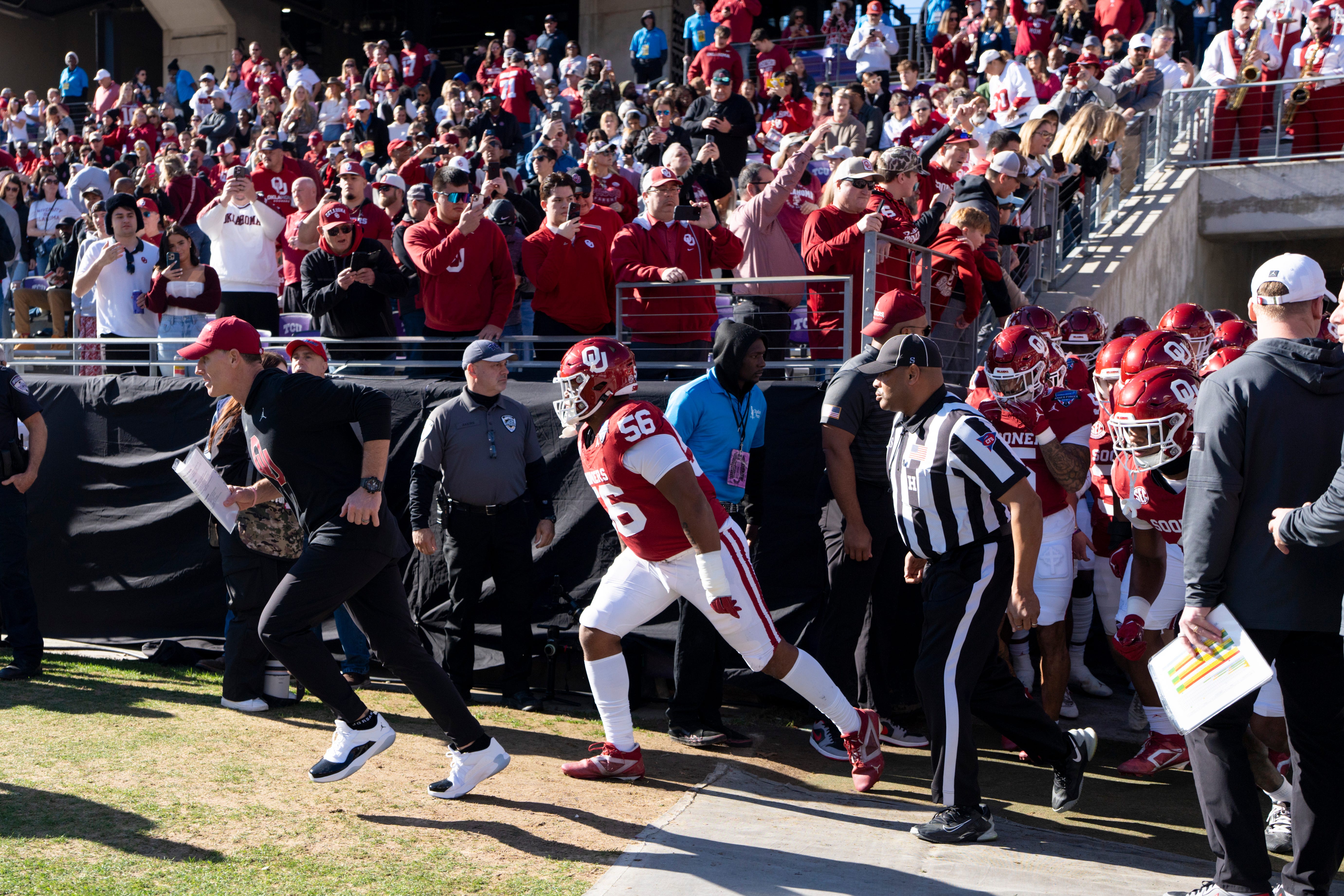 Oklahoma coach Brent Venables runs out with the team before the Armed Forces Bowl football game between the University of Oklahoma Sooners (OU) and the Navy Midshipmen at Amon G. Carter Stadium in Fort Worth, Texas, Friday, Dec. 27, 2024. Navy won 21-20.