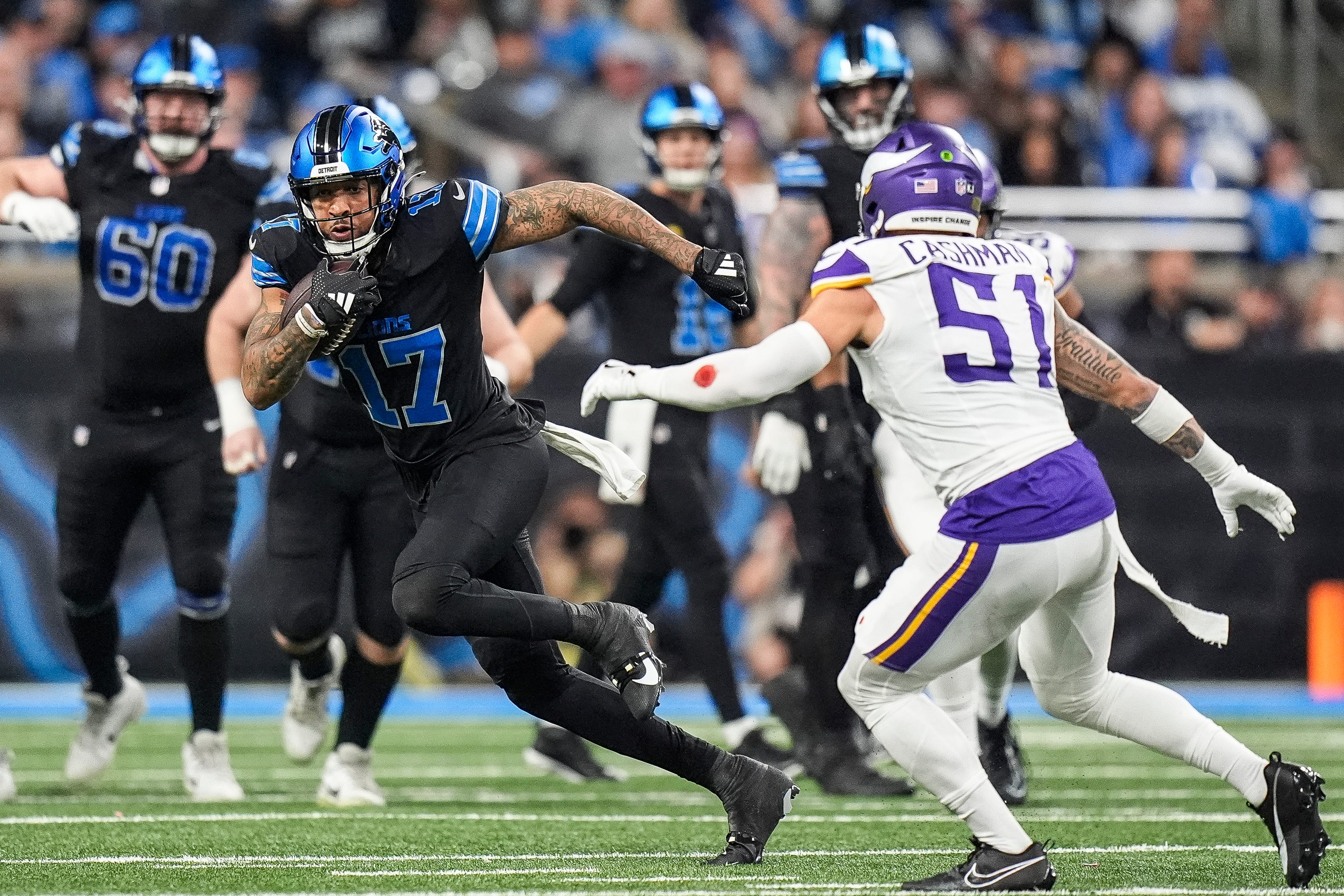Detroit Lions wide receiver Tim Patrick (17) runs against Minnesota Vikings linebacker Blake Cashman (51) during the first half at Ford Field in Detroit on Sunday, Jan. 5, 2025.