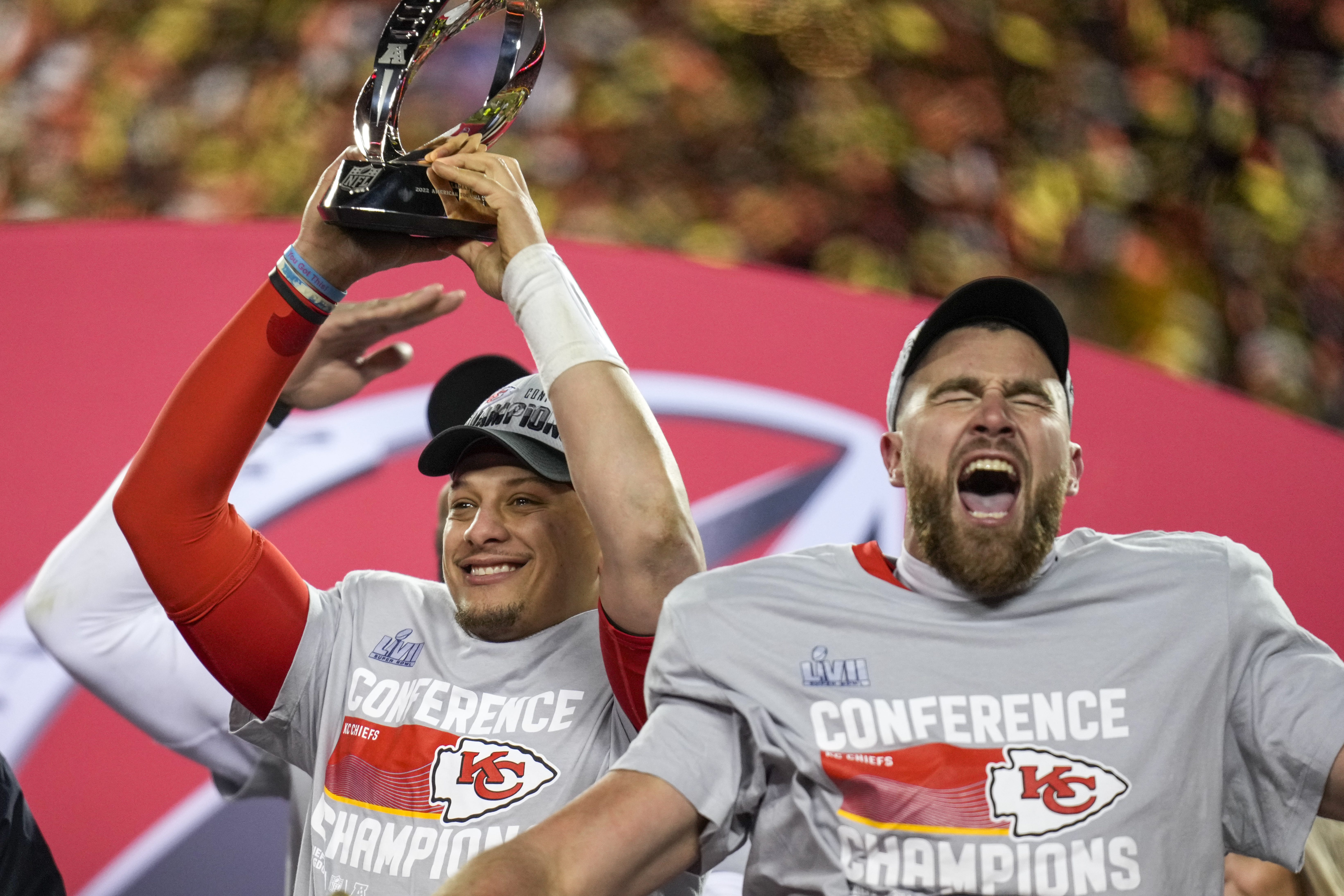 Kansas City Chiefs quarterback Patrick Mahomes (15) raises the Lamar Hunt Trophy with tight end Travis Kelce (87) after the AFC championship NFL game between the Cincinnati Bengals and the Kansas City Chiefs on Jan. 29, 2023, at Arrowhead Stadium in Kansas City.