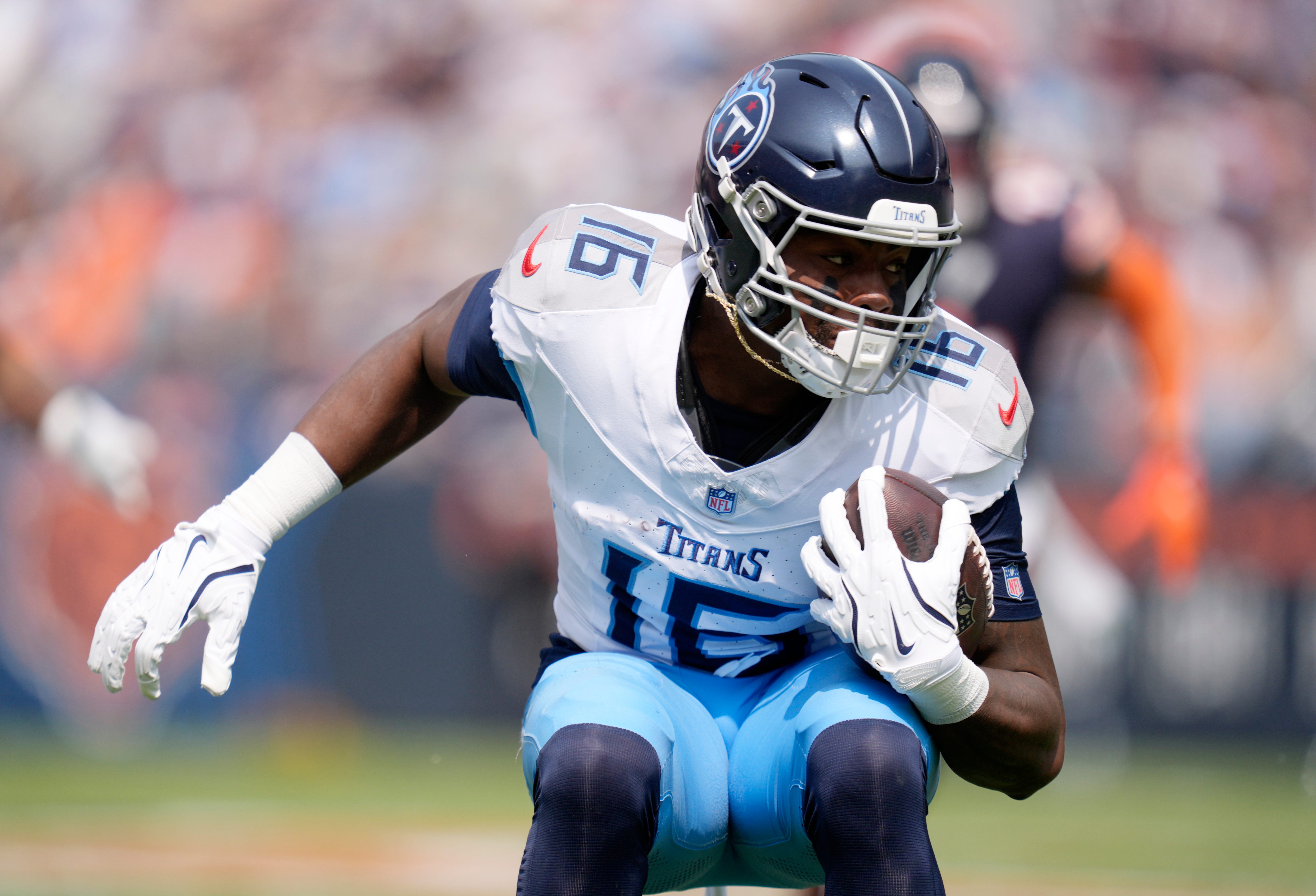 Tennessee Titans wide receiver Treylon Burks (16) runs against the Chicago Bears during the third quarter at Soldier Field in Chicago, Ill., Sunday, Sept. 8, 2024.
