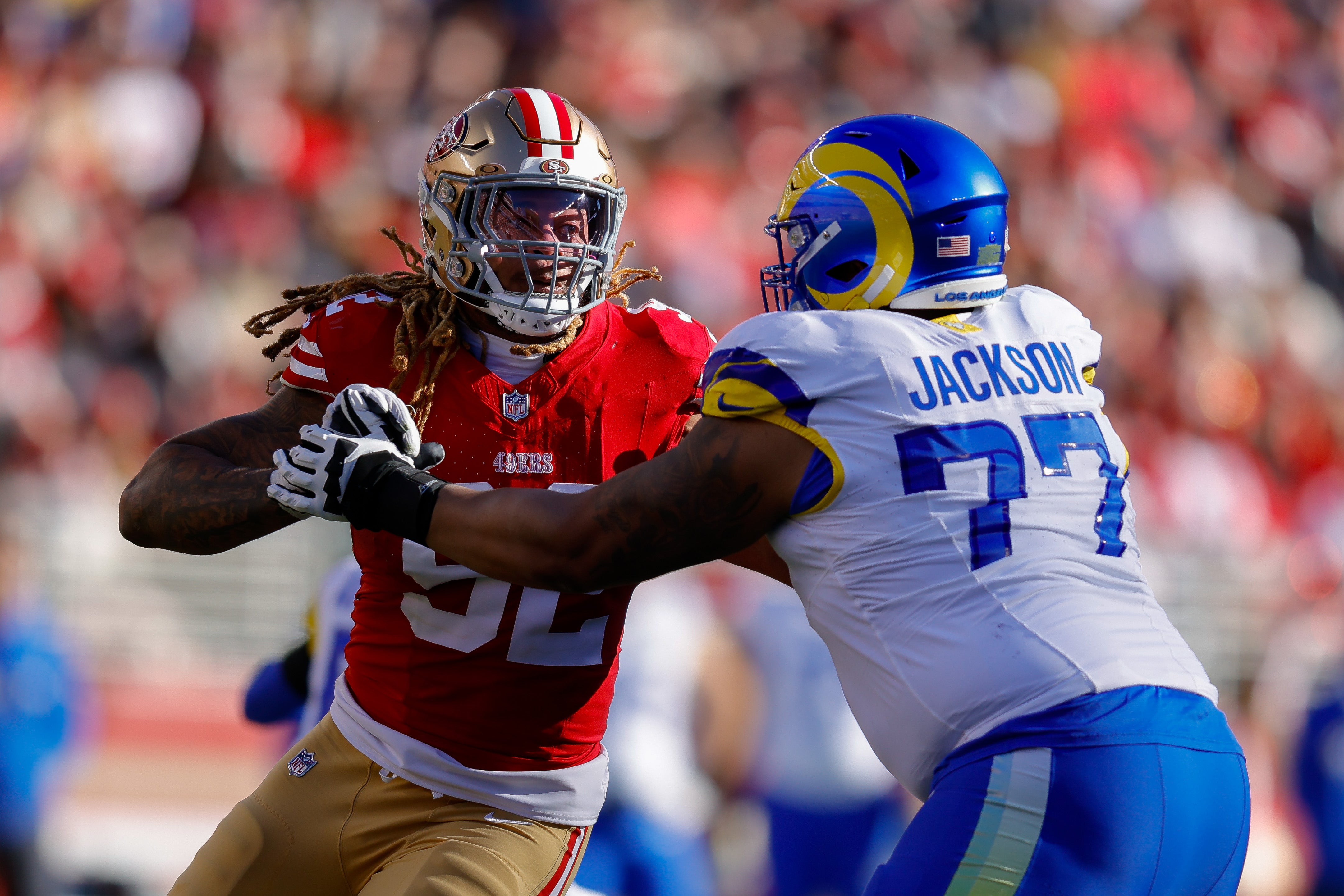 Jan 7, 2024; Santa Clara, California, USA; San Francisco 49ers defensive end Chase Young (92) rushes the passer against Los Angeles Rams offensive tackle Alaric Jackson (77) during the second quarter at Levi's Stadium.