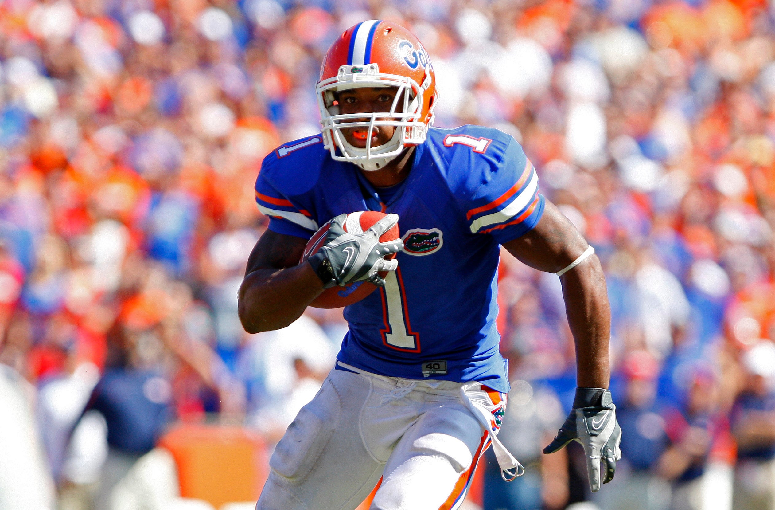 September 27, 2008; Gainesville FL, USA; Florida Gators running back Percy Harvin (1) runs to score a touchdown against Mississippi Rebels during the fourth quarter at Ben Hill Griffin Stadium. Mississippi beat the Gators 31-30.