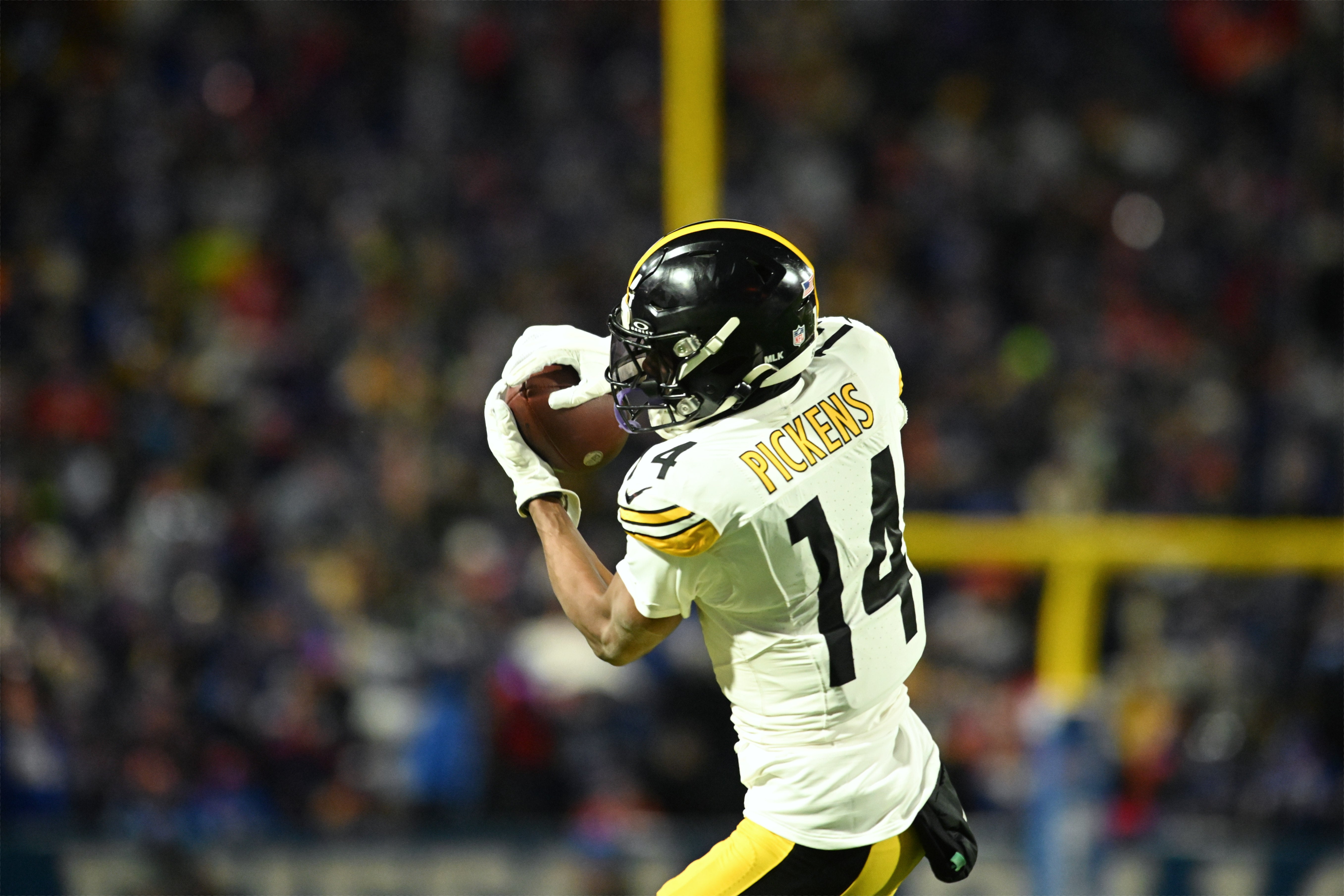 Jan 15, 2024; Orchard Park, New York, USA; Pittsburgh Steelers wide receiver George Pickens (14) makes a catch in the first half against the Buffalo Bills in a 2024 AFC wild card game at Highmark Stadium.