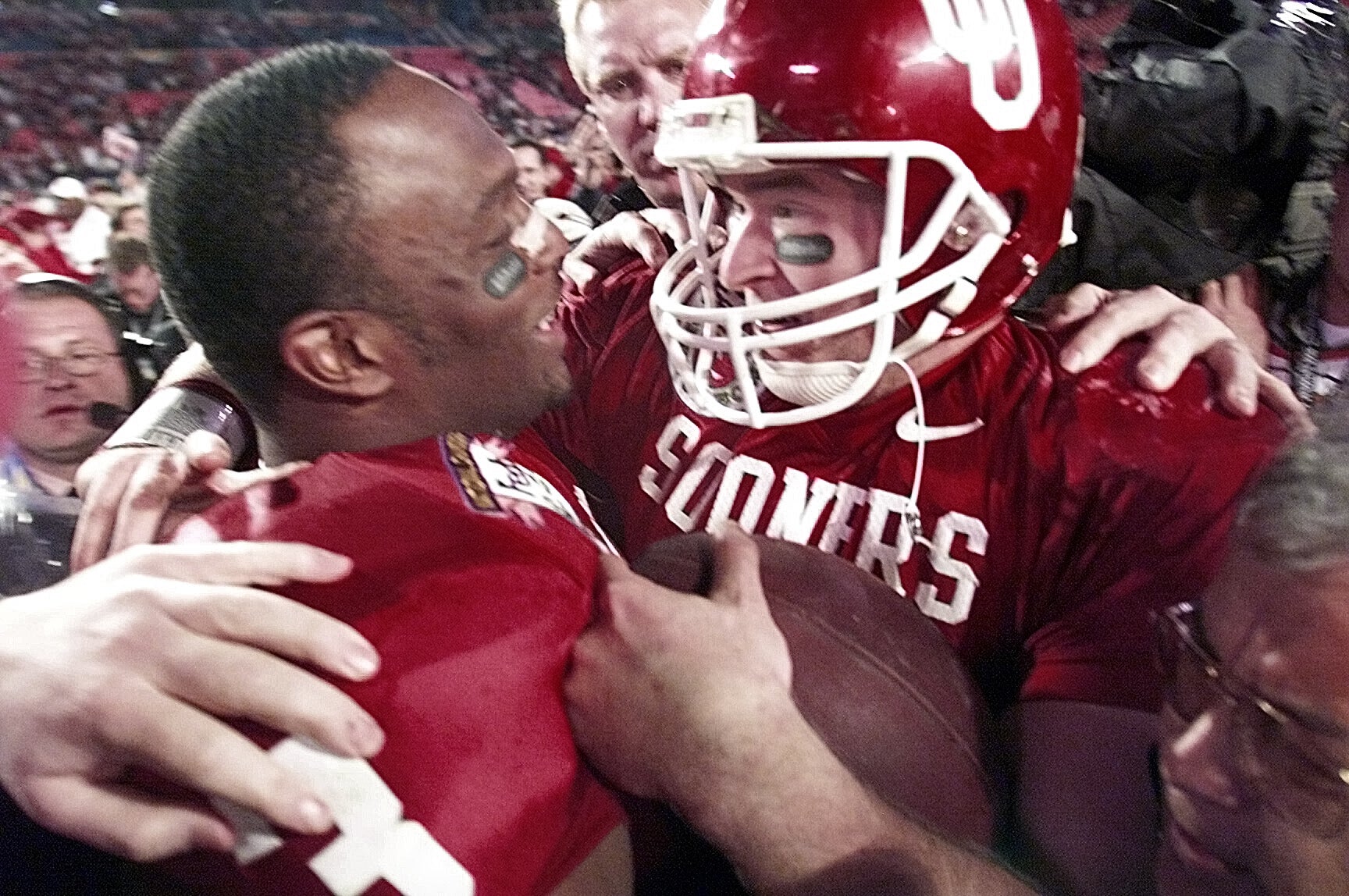January 3, 2001 Orange Bowl. Florida State vs. Oklahoma at Pro Player Stadium, Miami, Florida. Oklahoma Qb Josh Heupel hugs #3 Josh Norman after winning the Orange Bowl 13-2.