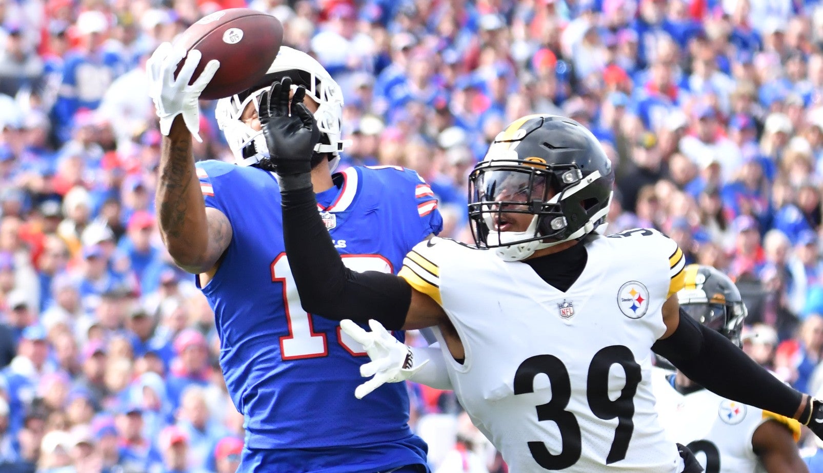 Oct 9, 2022; Orchard Park, New York, USA; Buffalo Bills wide receiver Gabe Davis (13) makes a one handed catch for a touchdown over Pittsburgh Steelers safety Minkah Fitzpatrick (39) in the second quarter at Highmark Stadium.