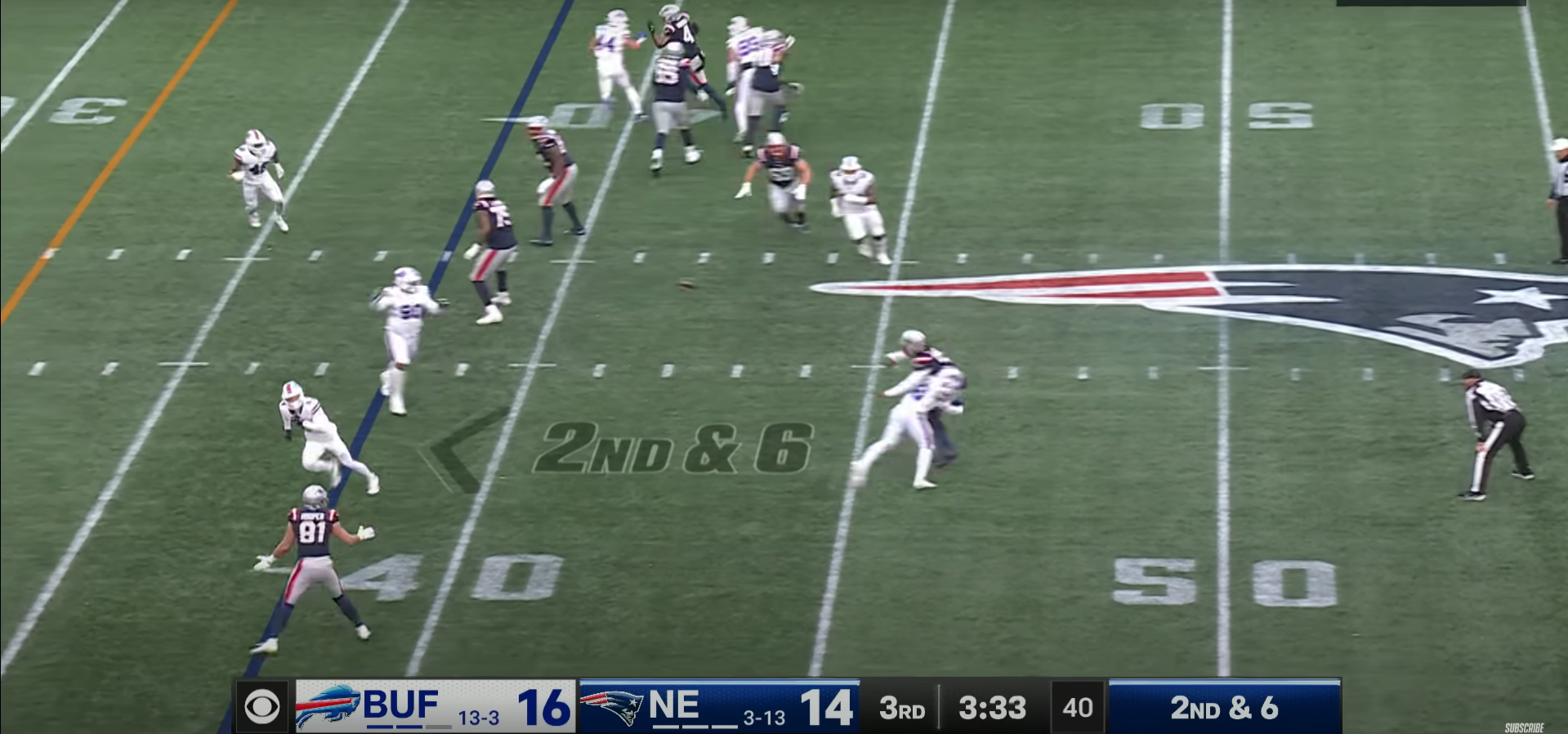 New Dallas Cowboys quarterback Joe Milton throws a pass while being hit during his time in New England.