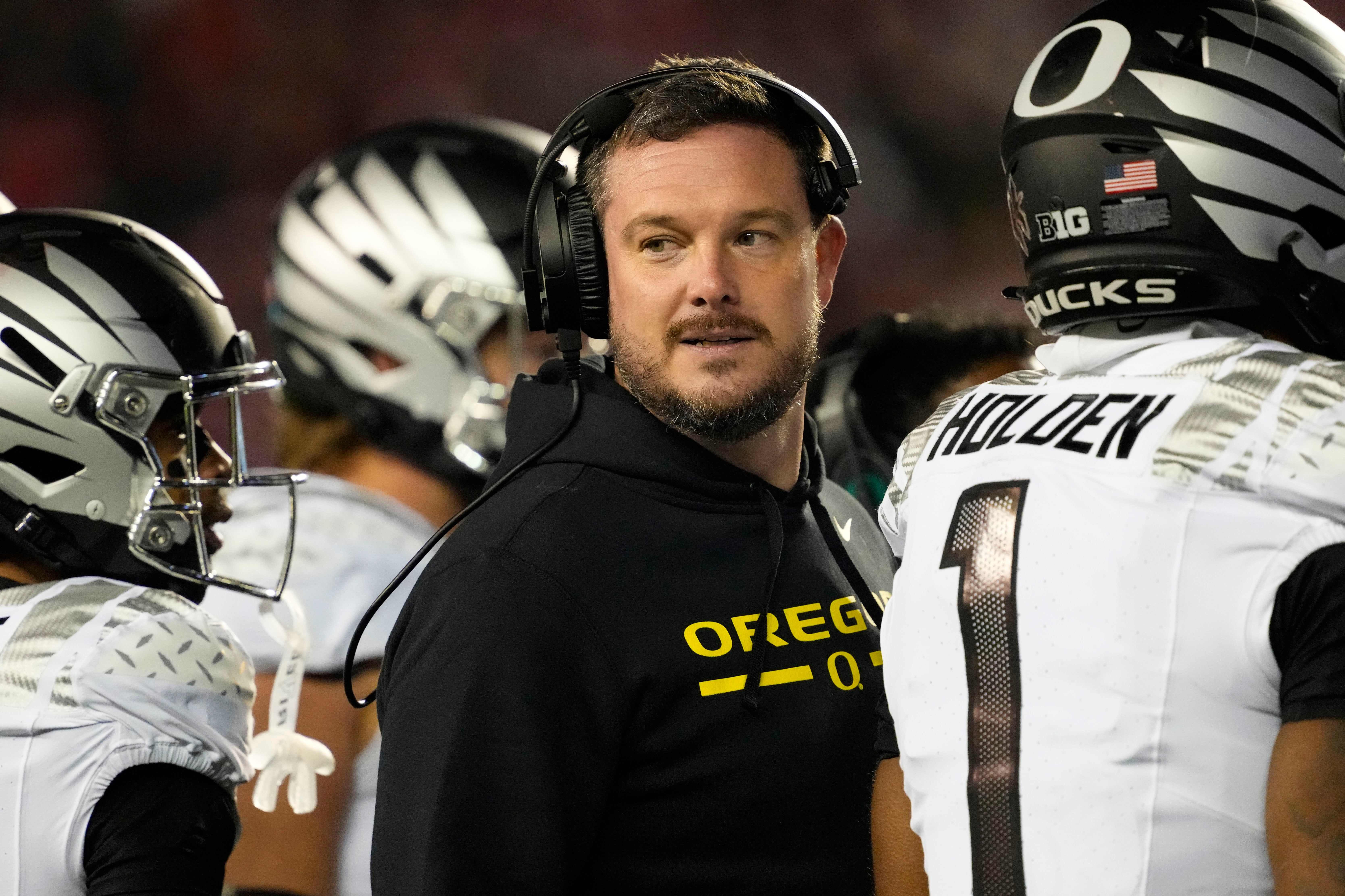 Nov 16, 2024; Madison, Wisconsin, USA; Oregon Ducks head coach Dan Lanning looks on during the third quarter against the Wisconsin Badgers at Camp Randall Stadium. Mandatory Credit: Jeff Hanisch-Imagn Images