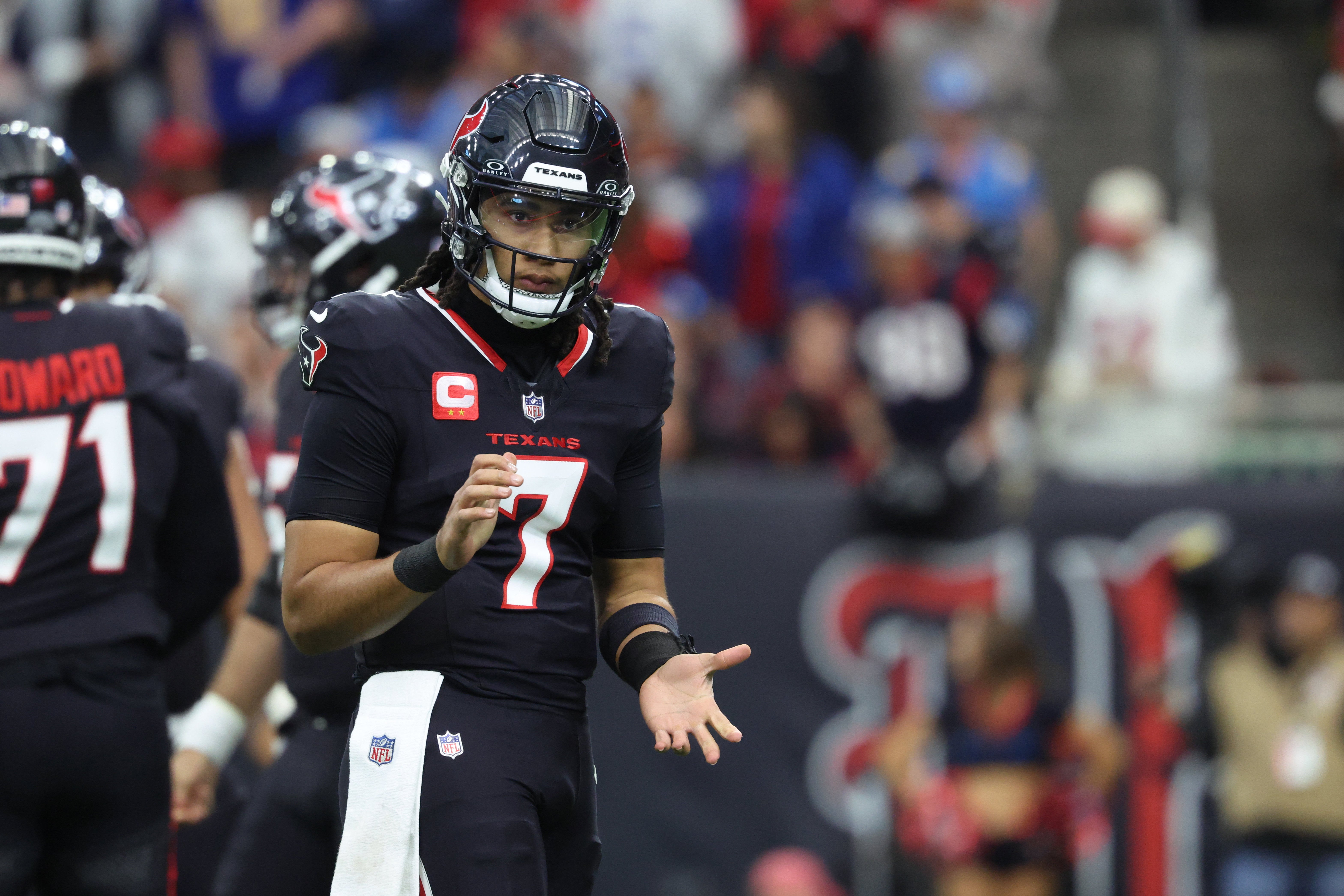 Jan 11, 2025; Houston, Texas, USA; Houston Texans quarterback C.J. Stroud (7) reacts after a play during the second quarter against the Los Angeles Chargers in an AFC wild card game at NRG Stadium.