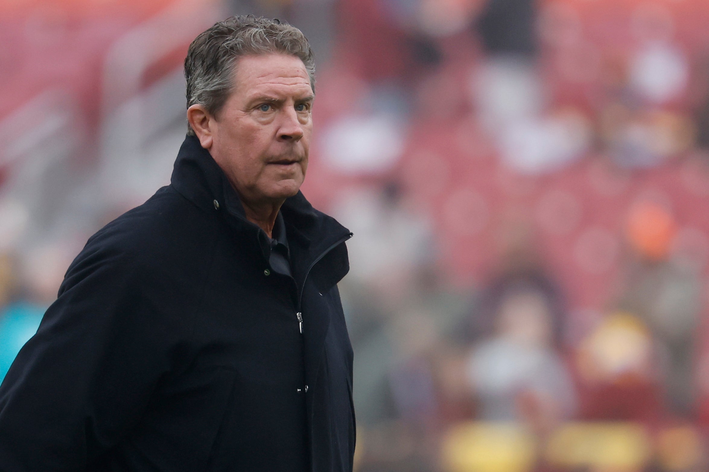 Dec 3, 2023; Landover, Maryland, USA; NFL Hall of Fame quarterback Dan Marino stands on the field during warm up prior to the Miami Dolphins game against the Washington Commanders at FedExField.