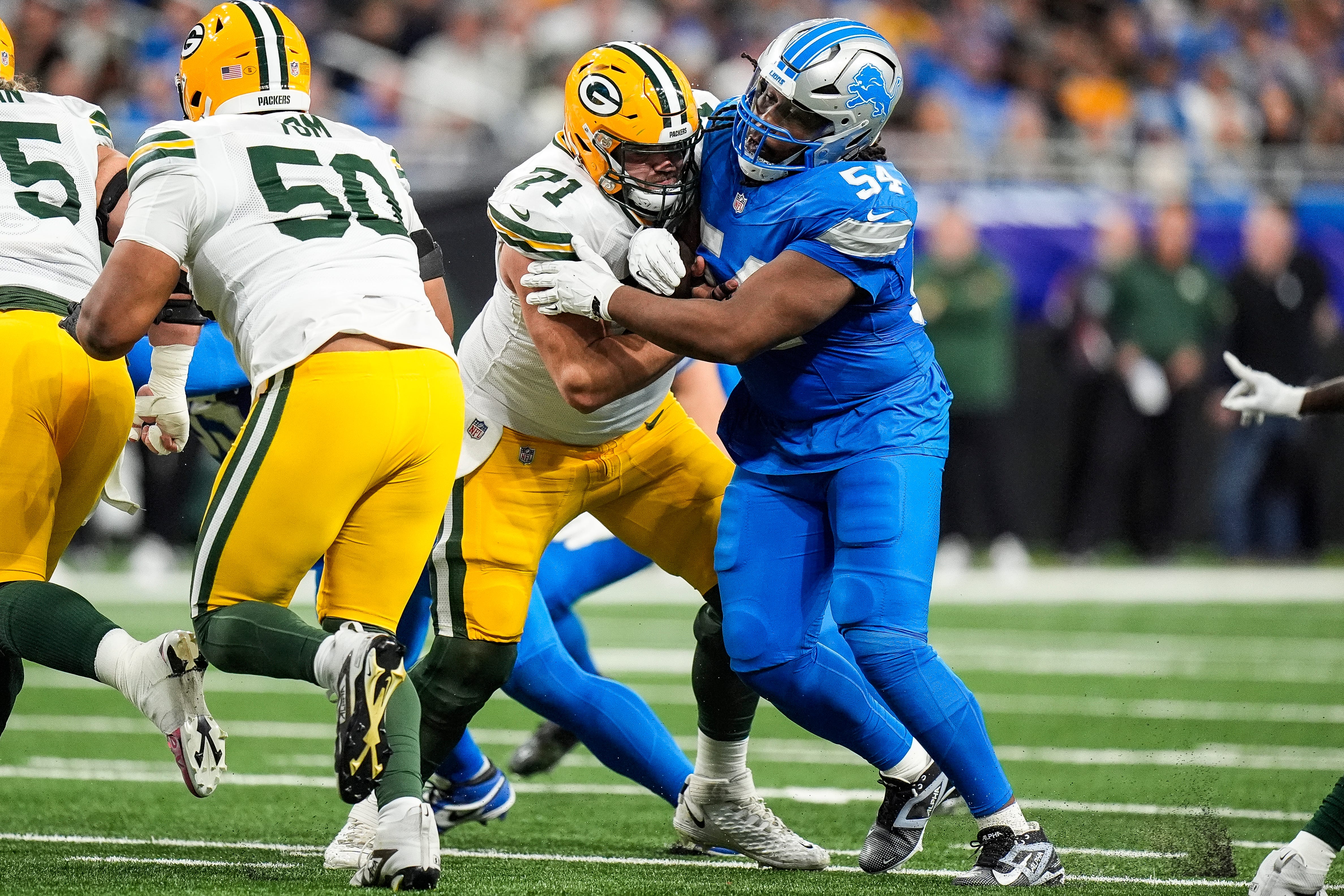 Detroit Lions defensive tackle Alim McNeill (54) pressures Green Bay Packers center Josh Myers (71) during the first half at Ford Field in Detroit on Thursday, Dec. 5, 2024.