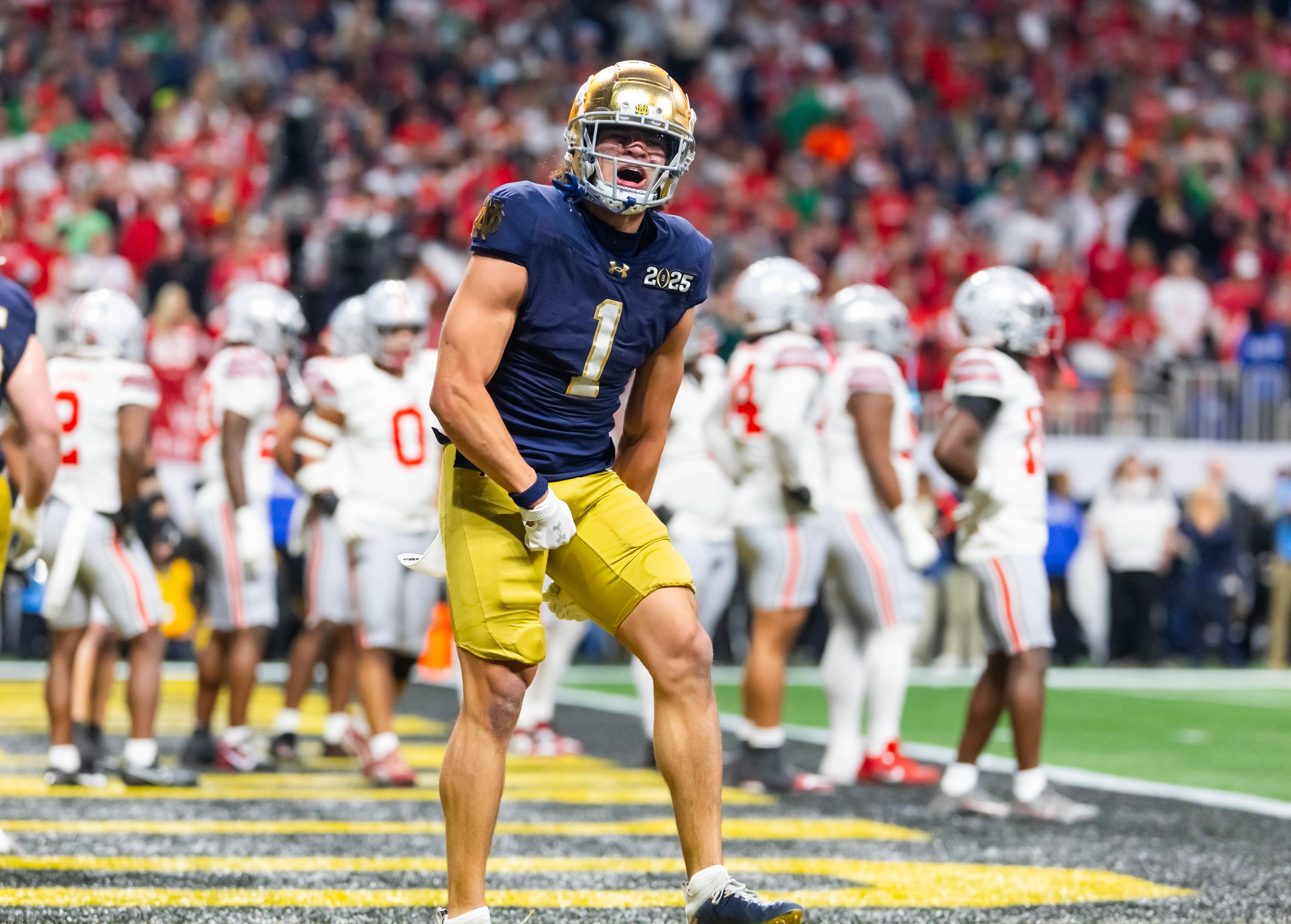 Jan 20, 2025; Atlanta, GA, USA; Notre Dame Fighting Irish wide receiver Jaden Greathouse (1) celebrates a touchdown against the Ohio State Buckeyes during the CFP National Championship college football game at Mercedes-Benz Stadium. Mandatory Credit: Mark J. Rebilas-Imagn Images