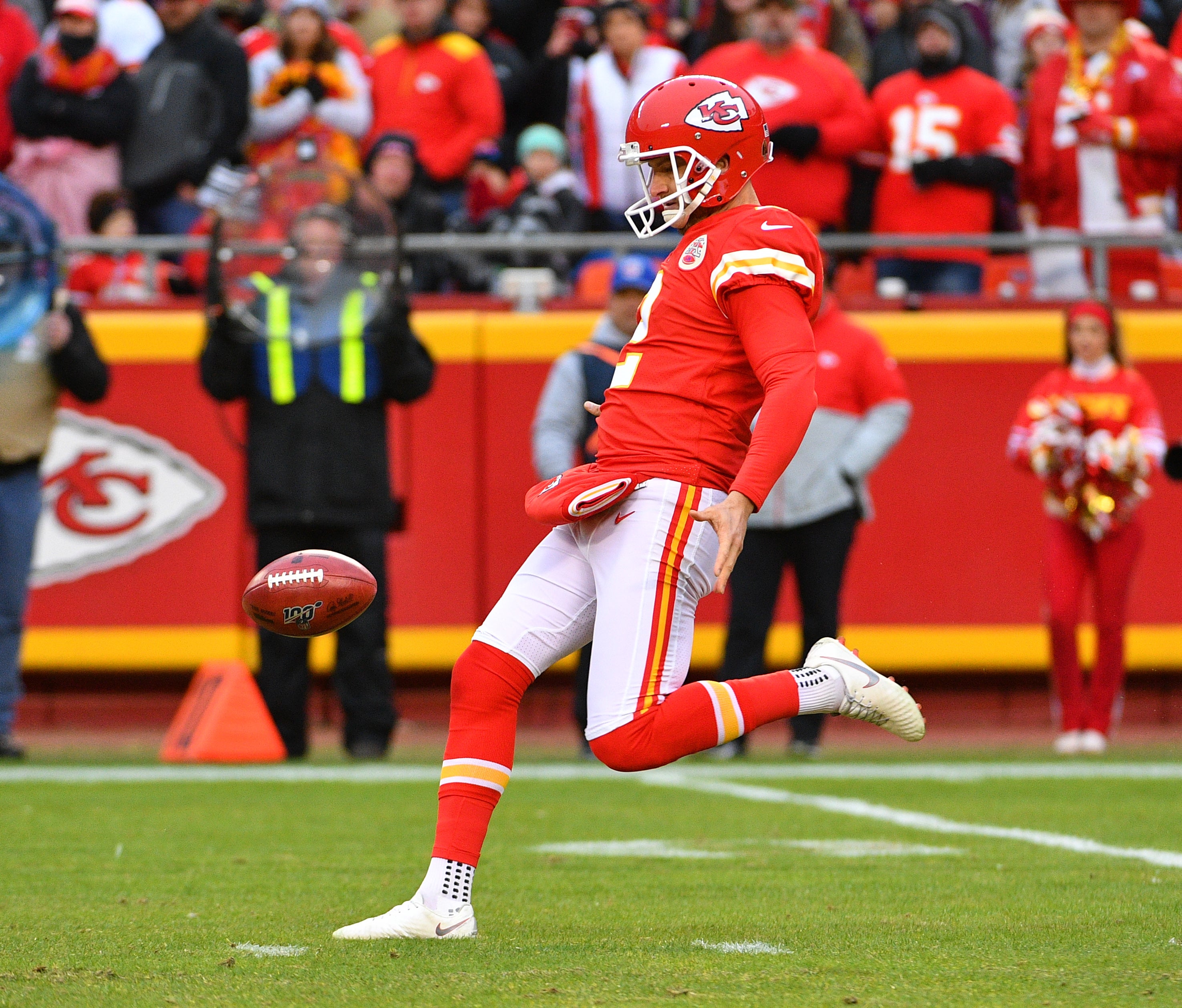 Kansas City Chiefs punter Dustin Colquitt (2) punts the ball during the game against the Los Angeles Chargers at Arrowhead Stadium.