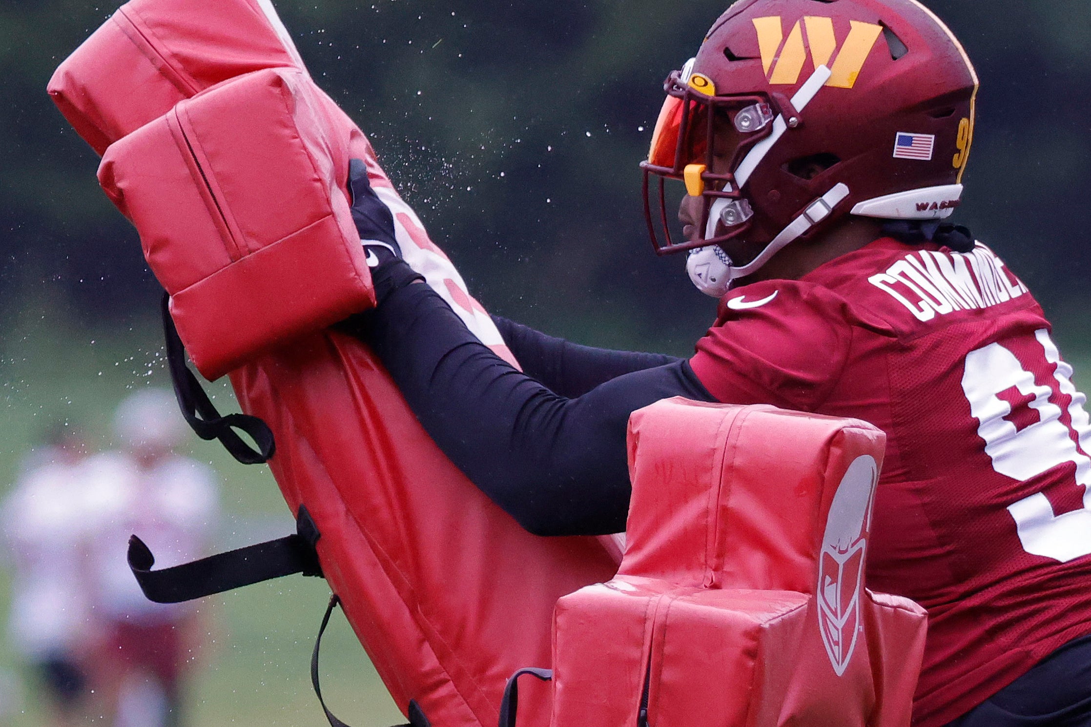 May 24, 2022; Asburn, VA, USA; Washington Commanders defensive tackle Daron Payne (94) works with a blocking dummy during drills as part of OTAs at The Park in Ashburn.