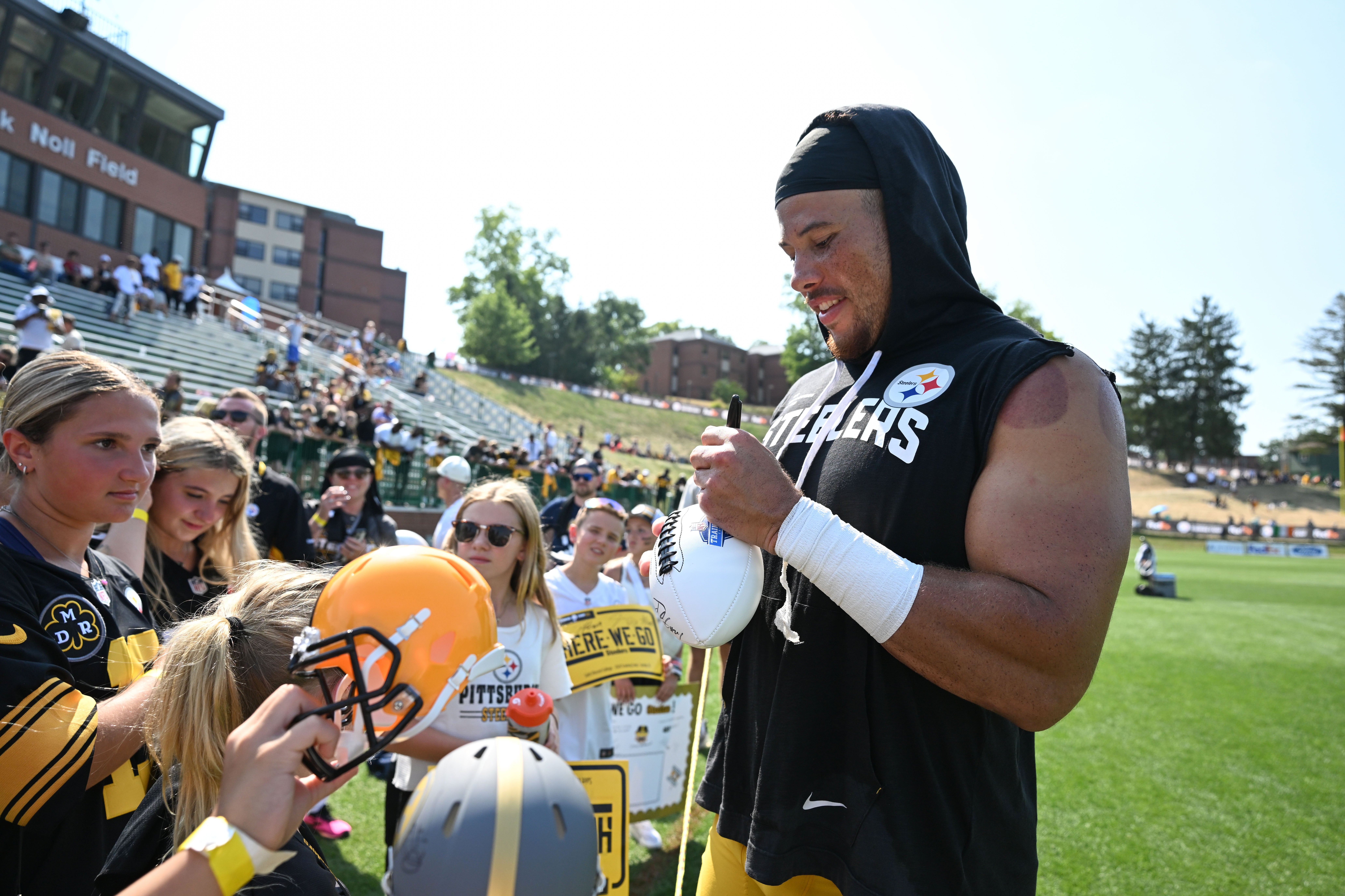 Jul 28, 2024; Latrobe, PA, USA; Pittsburgh Steelers linebacker Alex Highsmith (56) signs autographs for fans during training camp at Saint Vincent College.
