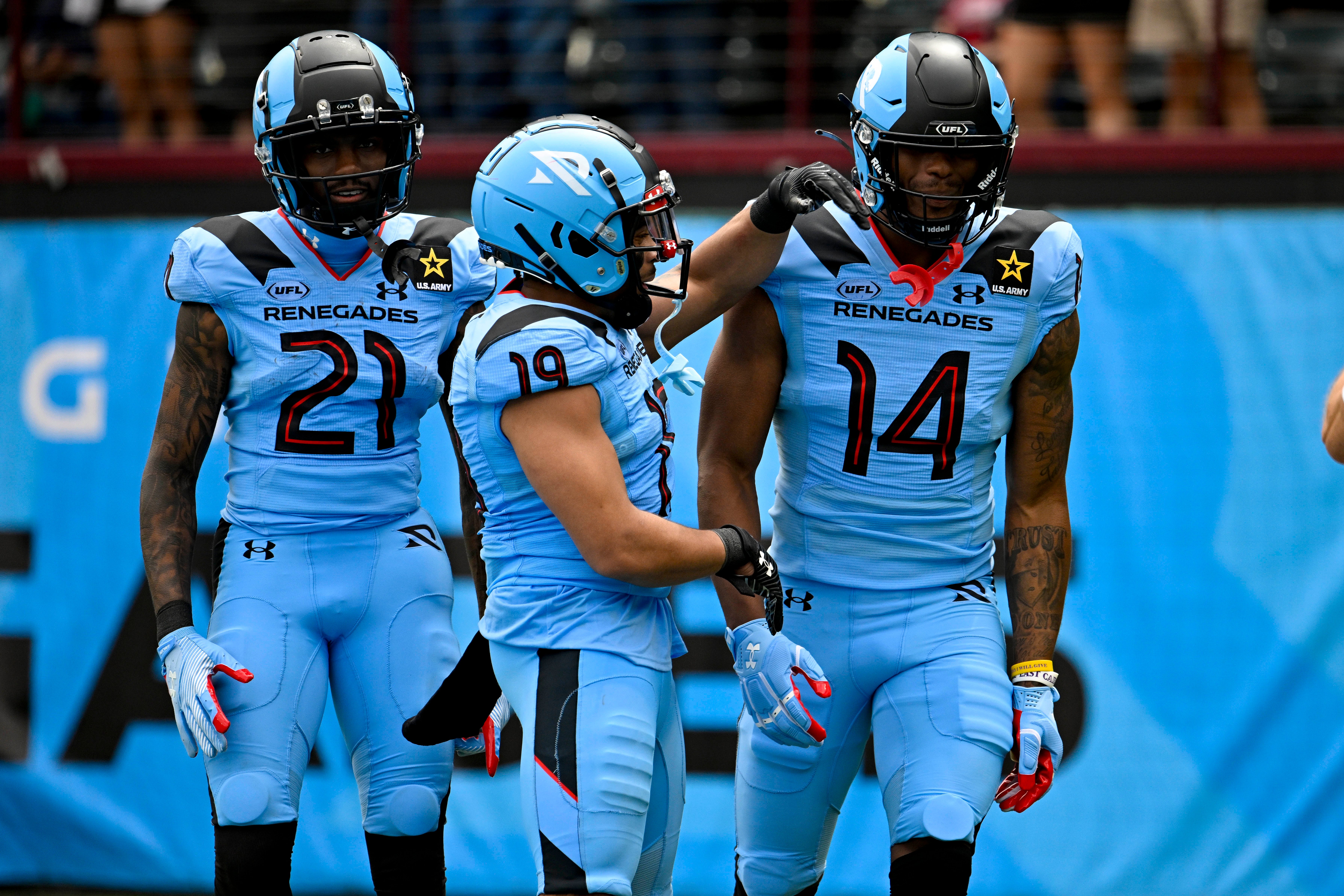 Arlington Renegades wide receiver Isaiah Winstead (14) and wide receiver Deontay Burnett (21) and wide receiver Juwan Manigo (19) celebrate after Winstead catches a pass for a touchdown against the Birmingham Stallions during the first half at Choctaw Stadium.