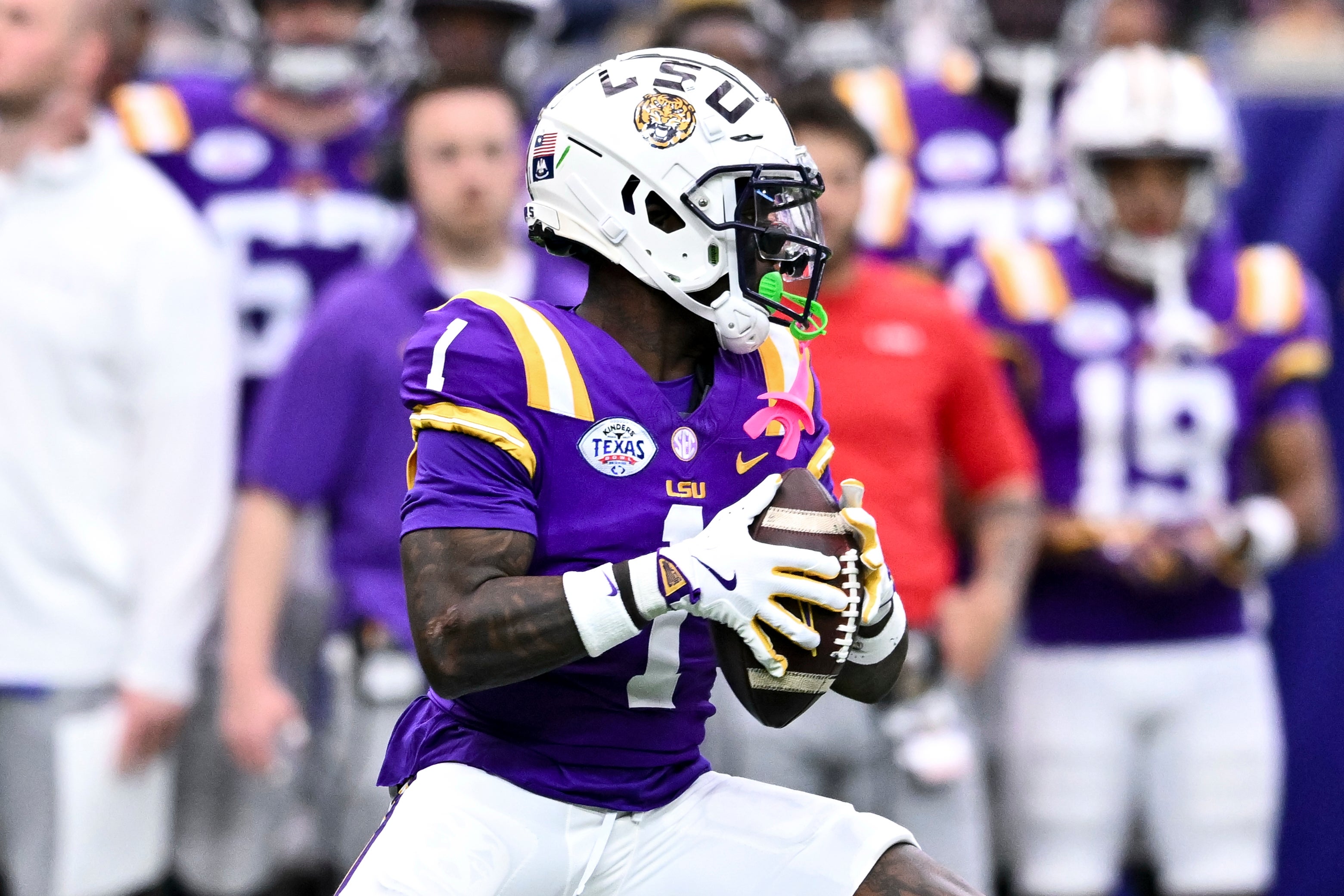 Dec 31, 2024; Houston, TX, USA; LSU Tigers wide receiver Aaron Anderson (1) runs the ball during the first half against the Baylor Bears at NRG Stadium. The Tigers defeat the Bears 44-31.
