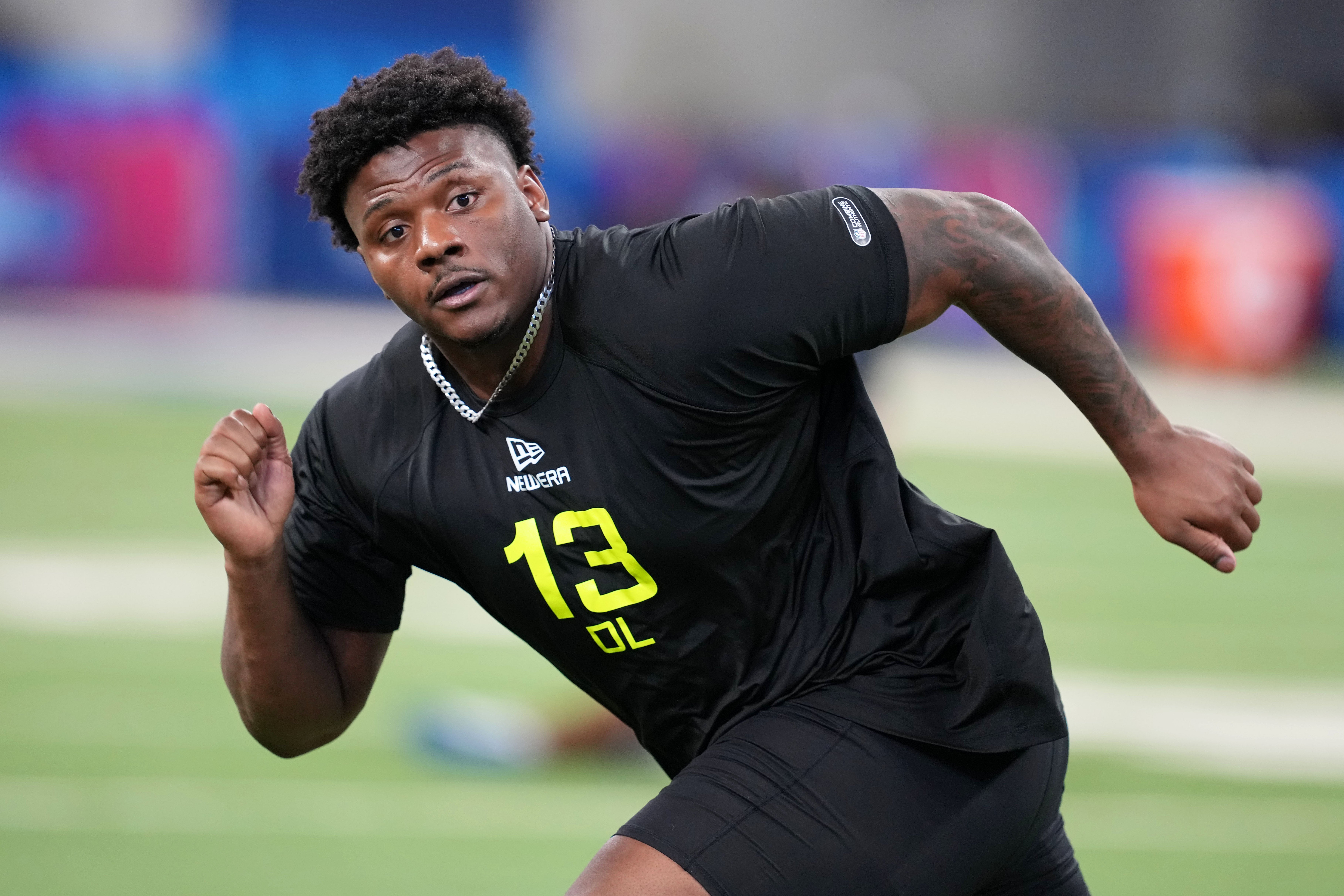 Feb 27, 2025; Indianapolis, IN, USA; Arkansas defensive lineman Eric Gregory (DL13) participates in drills during the 2025 NFL Combine at Lucas Oil Stadium.
