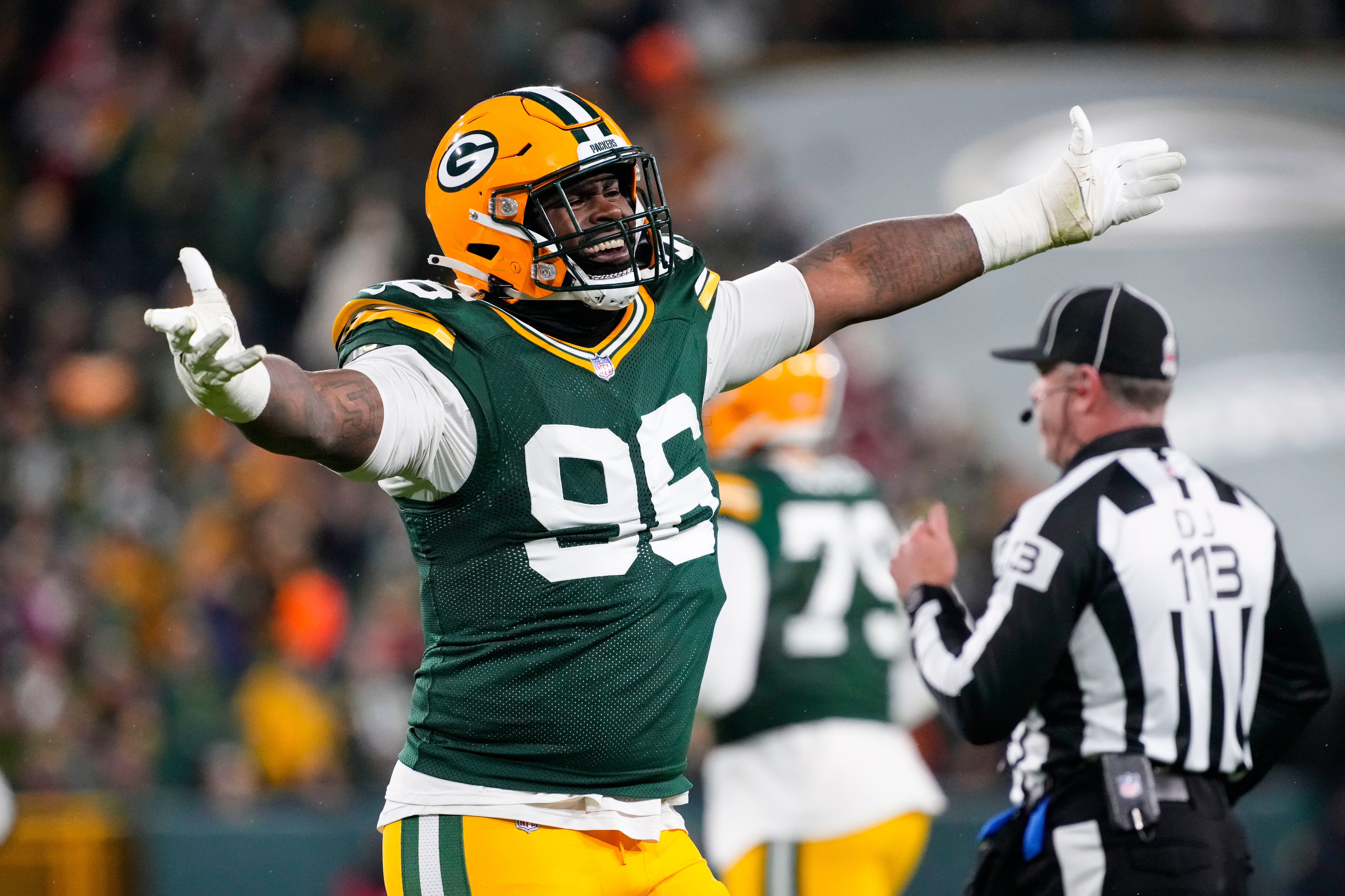 Green Bay Packers defensive lineman Colby Wooden (96) celebrates a play during the fourth quarter against the San Francisco 49ers at Lambeau Field.
