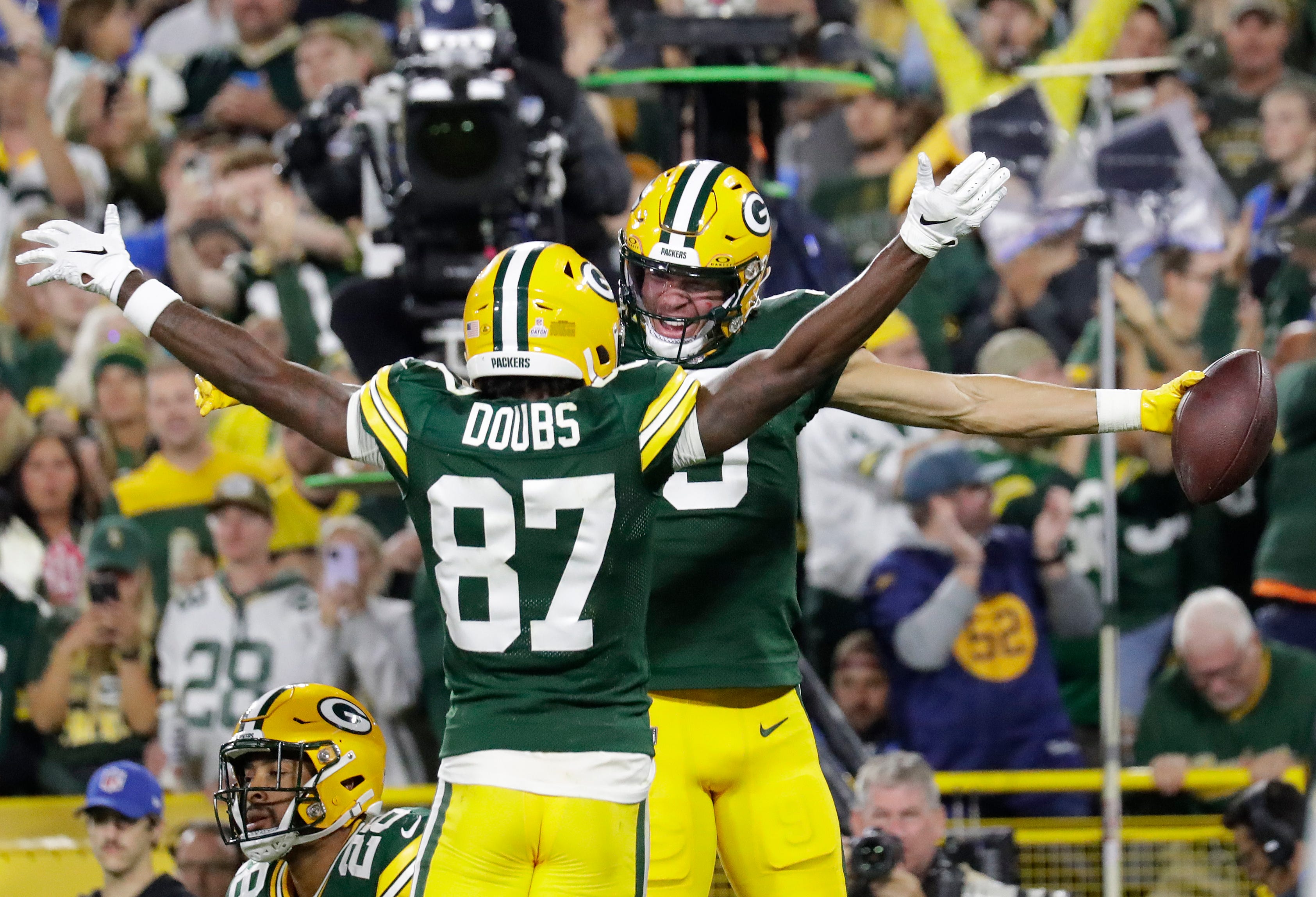 Green Bay Packers wide receiver Christian Watson (9) celebrates with wide receiver Romeo Doubs (87) after scoring a touchdown against the Detroit Lions during their football game Thursday, September 28, 2023, at Lambeau Field in Green Bay, Wis.