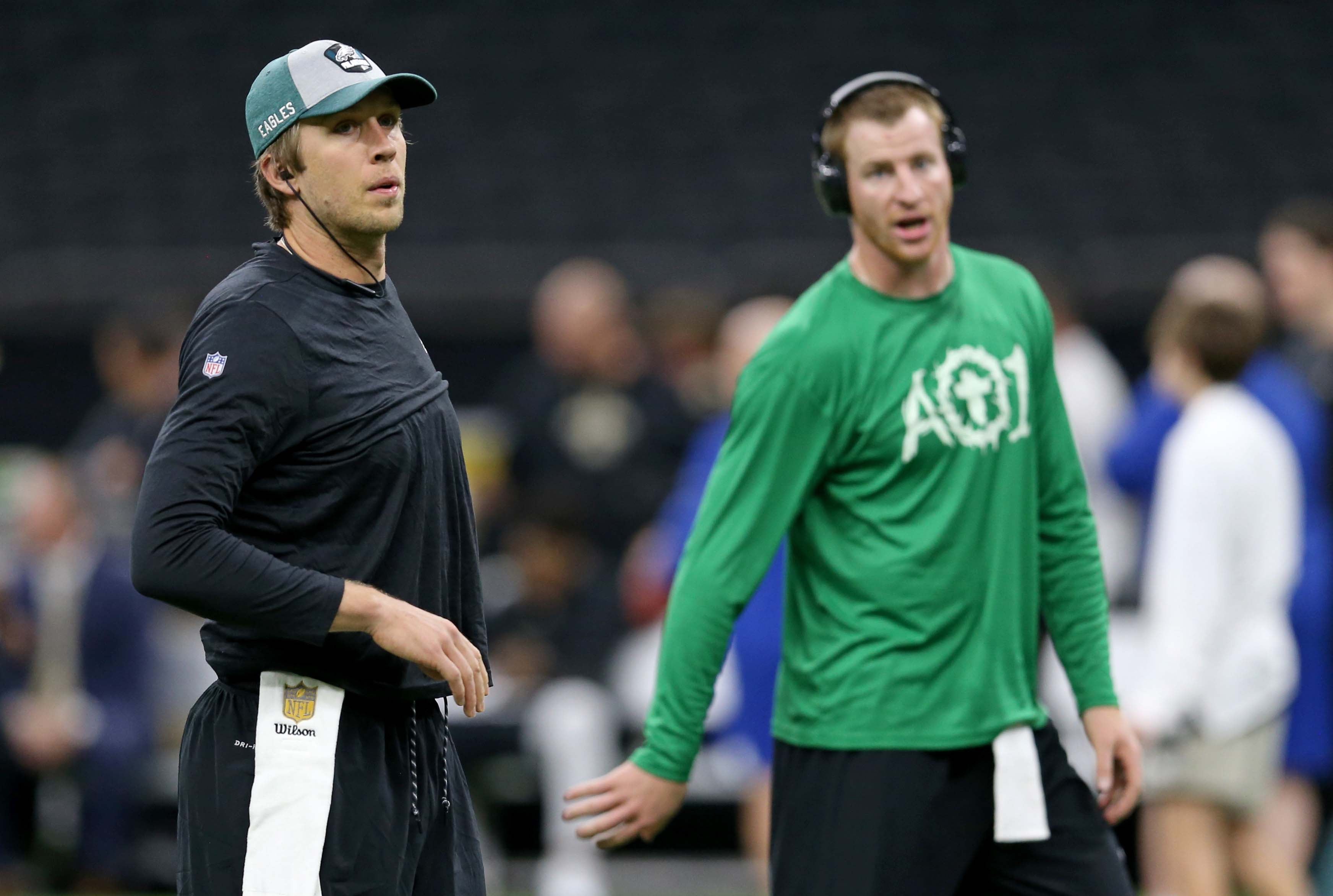 Nov 18, 2018; New Orleans, LA, USA; Philadelphia Eagles quarterbacks Nick Foles (9) and Carson Wentz warm up before their game against the New Orleans Saints at the Mercedes-Benz Superdome. Mandatory Credit: Chuck Cook-Imagn Images