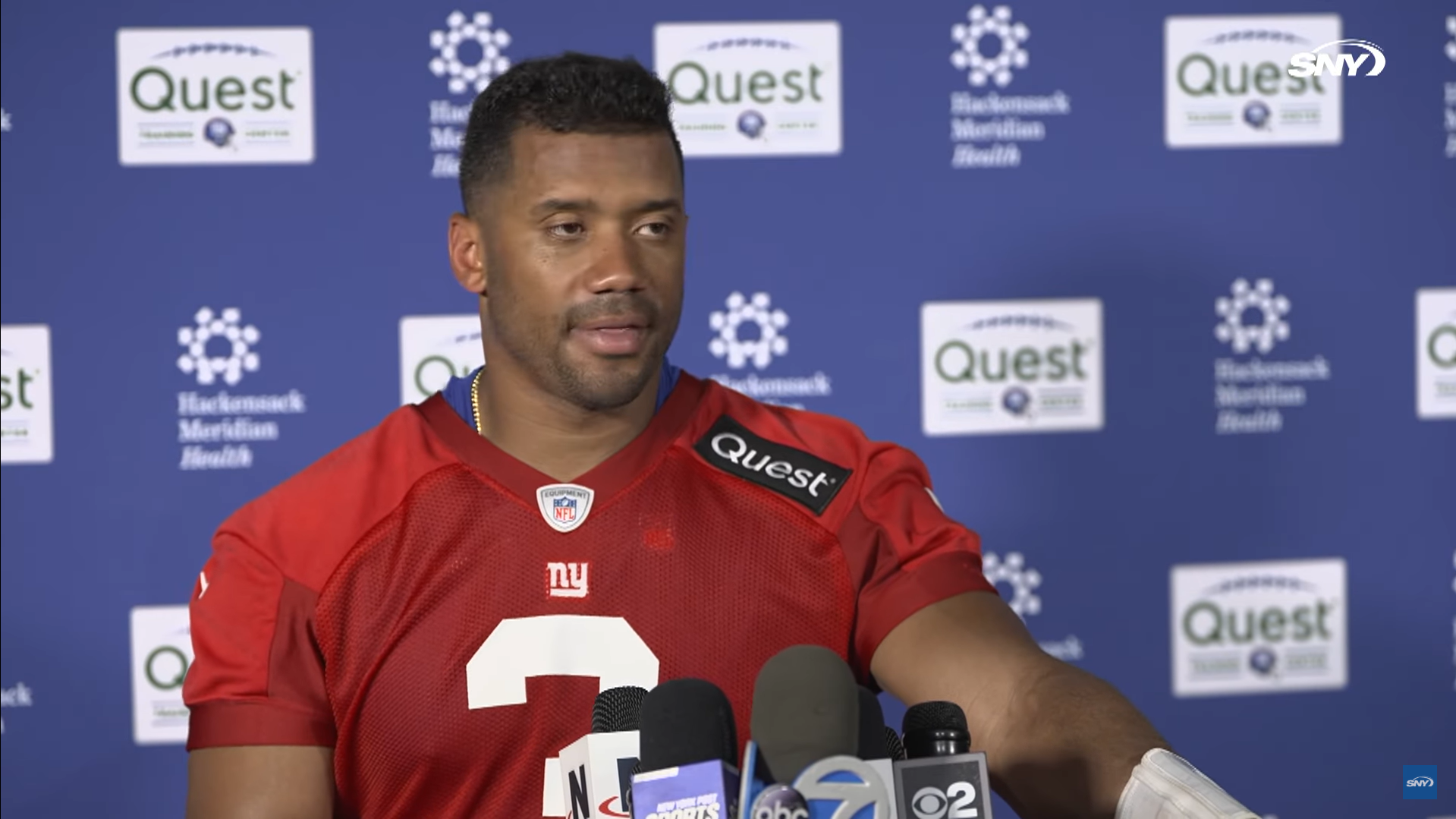 New York Giants QB Russell Wilson talks to reporters after OTAs practice.