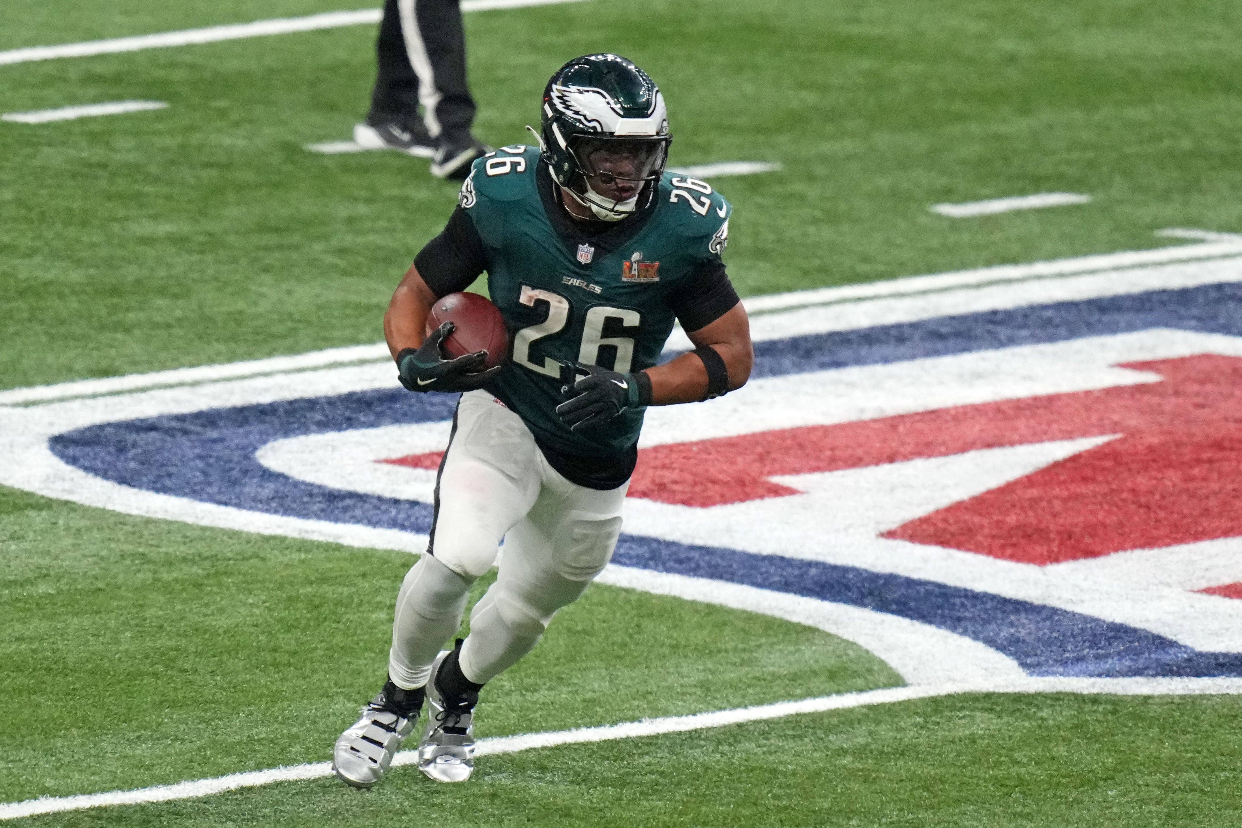 Philadelphia Eagles running back Saquon Barkley (26) rushes the ball against the Kansas City Chiefs during the third quarter in Super Bowl LIX at Caesars Superdome.