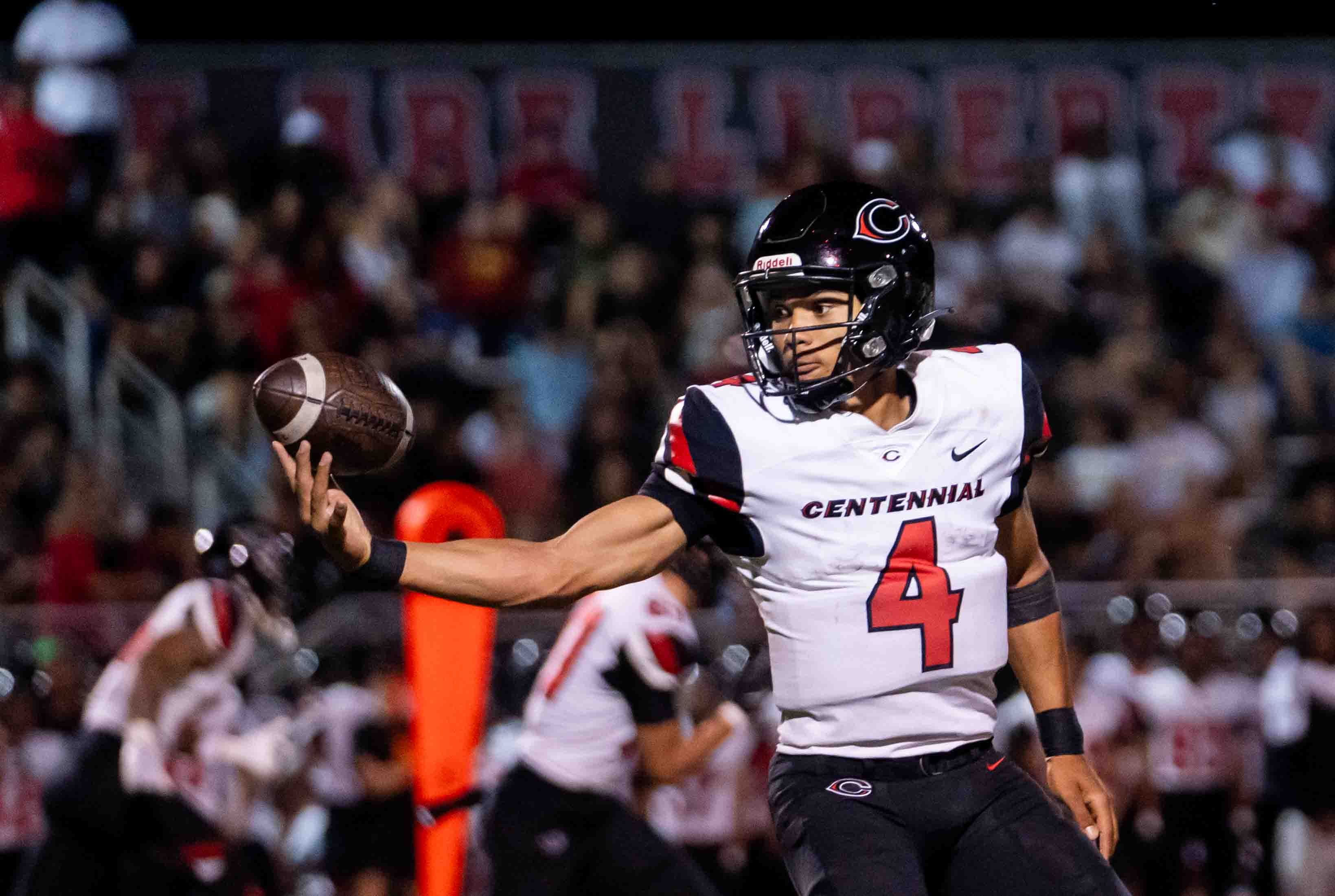 Centennial Huskies Quarterback Husan Longstreet (4) catches the ball at Liberty High School on Sept. 21, 2024, in Peoria.