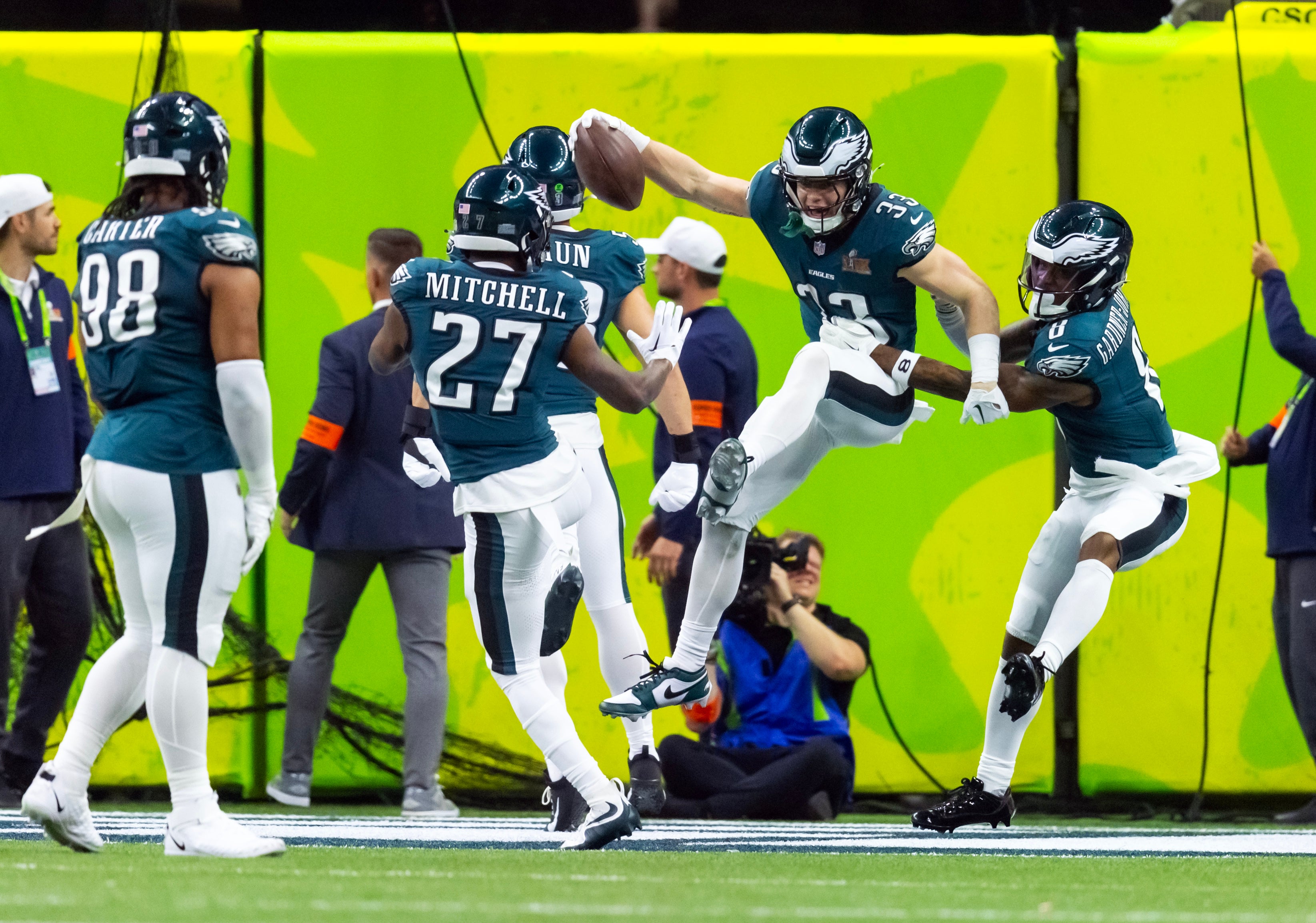 Philadelphia Eagles cornerback Cooper DeJean (33) celebrates with teammates after returning an interception for a touchdown against the Kansas City Chiefs during Super Bowl LIX at Caesars Superdome.