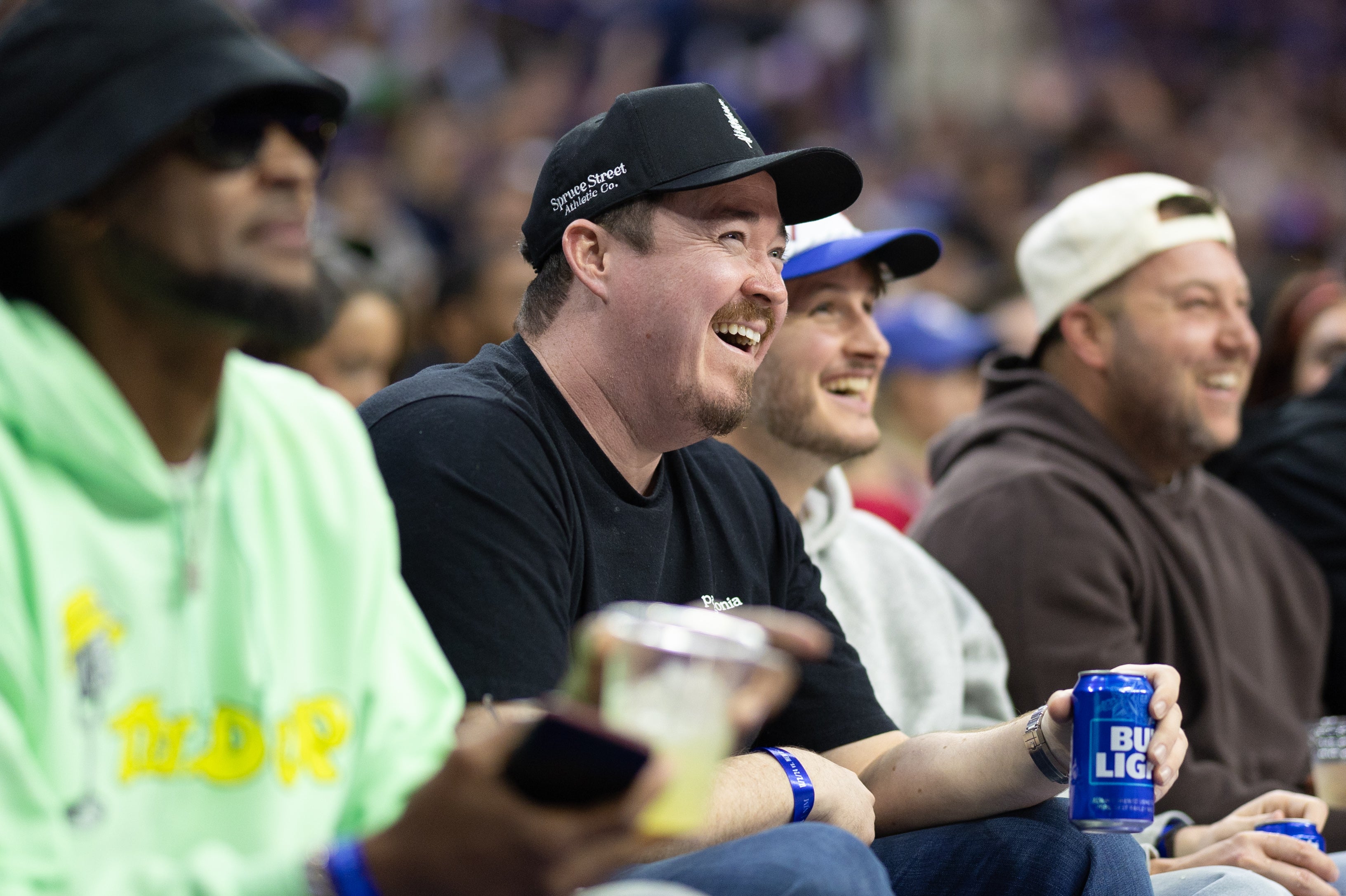 Nov 2, 2024; Philadelphia, Pennsylvania, USA; Comedian Shane Gillis (M) looks on during the second quarter of action between the Philadelphia 76ers and the Memphis Grizzlies at Wells Fargo Center. Mandatory Credit: Bill Streicher-Imagn Images