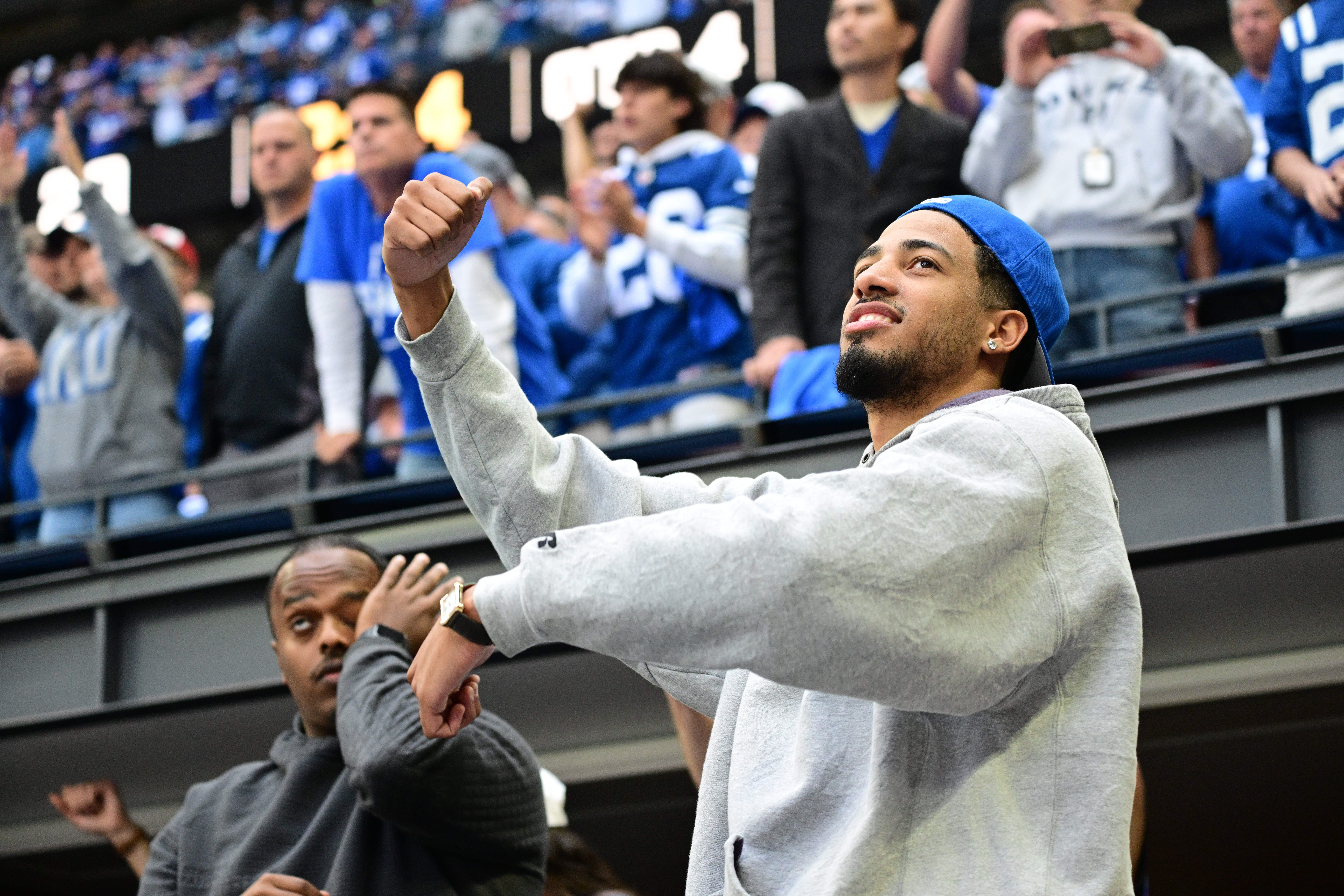 Sep 8, 2024; Indianapolis, Indiana, USA; Indiana Pacers Point Guard Tyrese Haliburton cheers for the Colts during the second half against the Houston Texans at Lucas Oil Stadium.