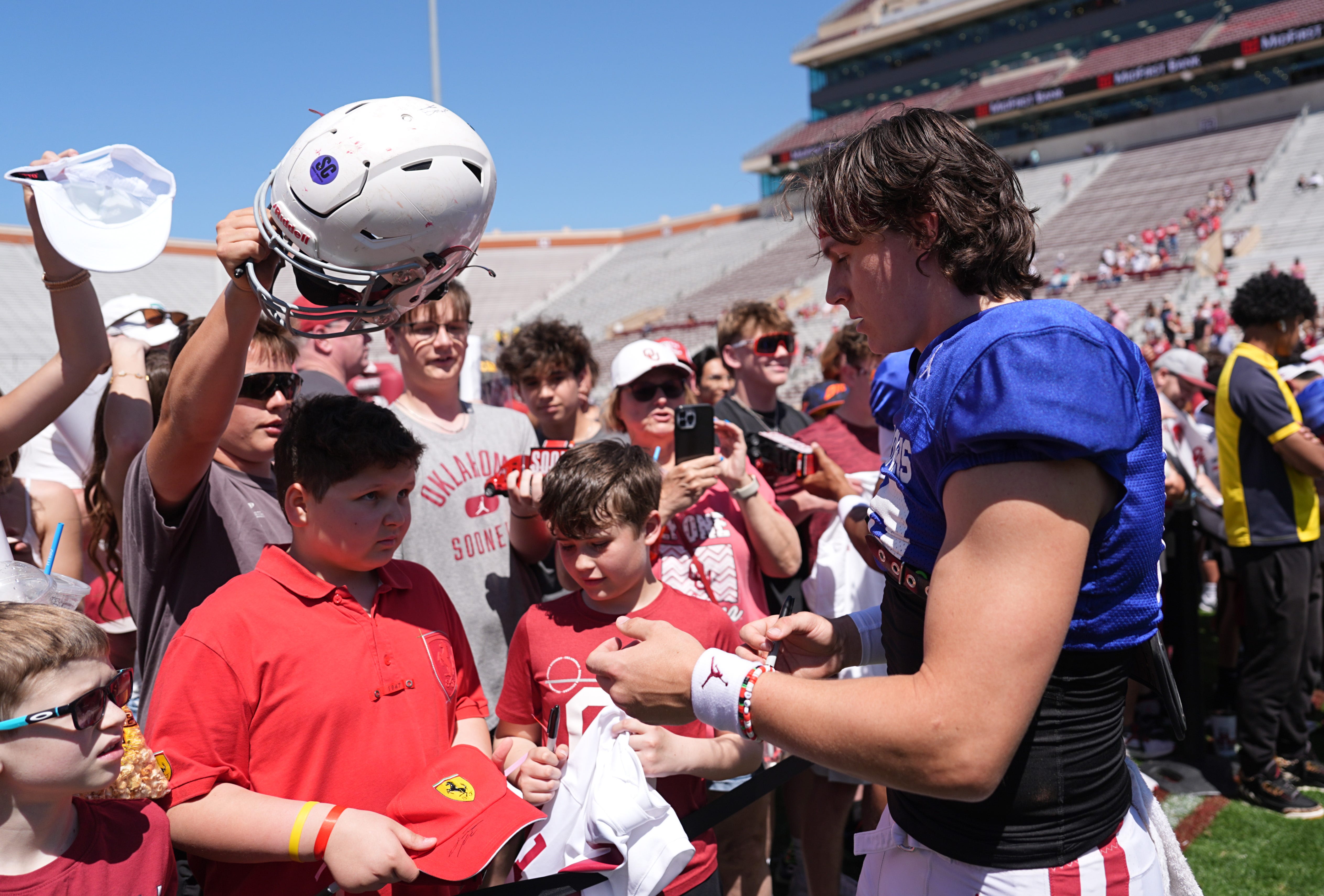 Oklahoma's John Mateer sings autographs during the University of Oklahoma Sooners Crimson Combine at Gaylord Family - Oklahoma Memorial Stadium in Norman, Okla., Saturday, April, 12, 2025.