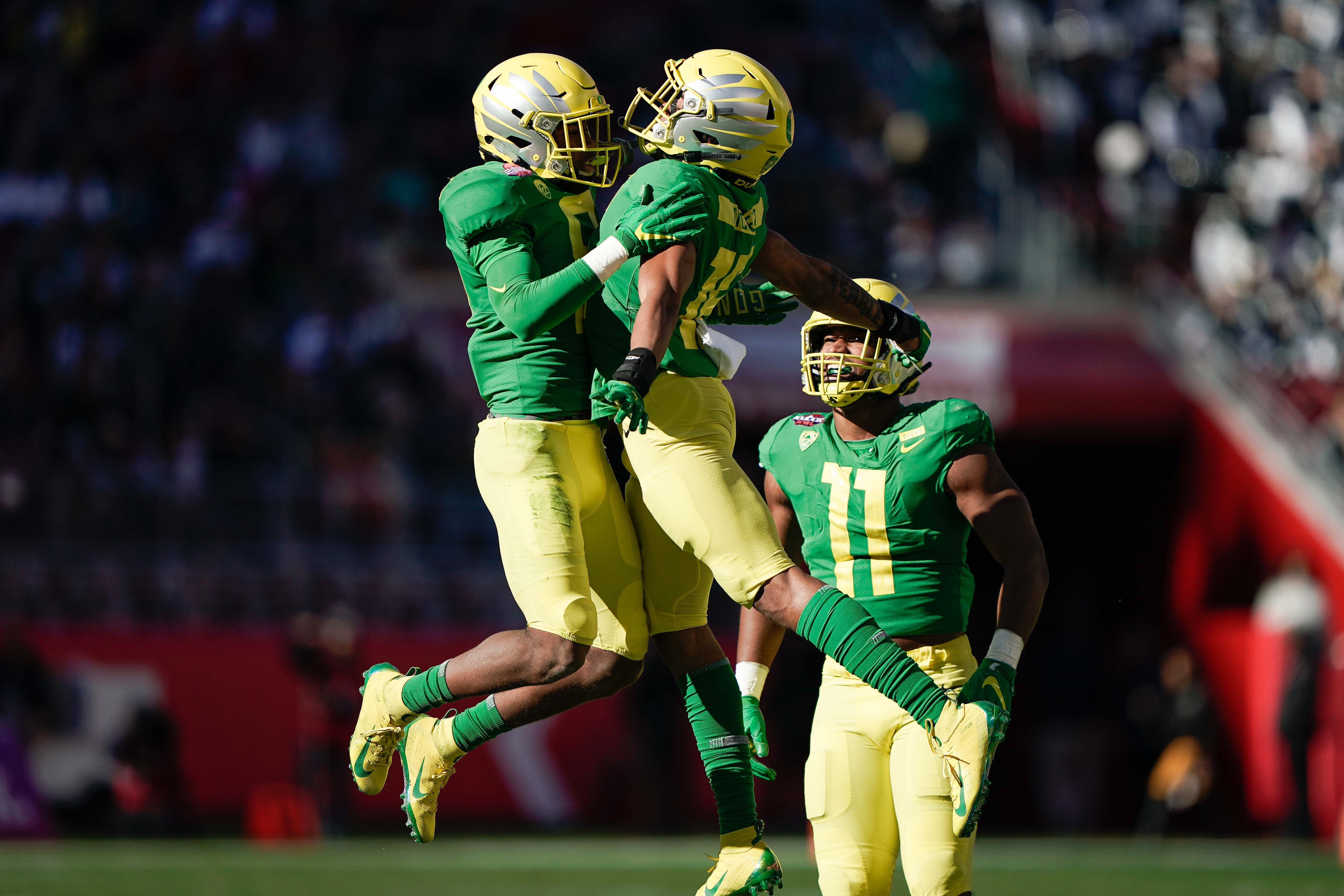 Dec 31, 2018; Santa Clara, CA, USA; Oregon Ducks safety Jevon Holland (8) and safety Nick Pickett (16) celebrate against the Michigan State Spartans during the second quarter at Levi's Stadium.