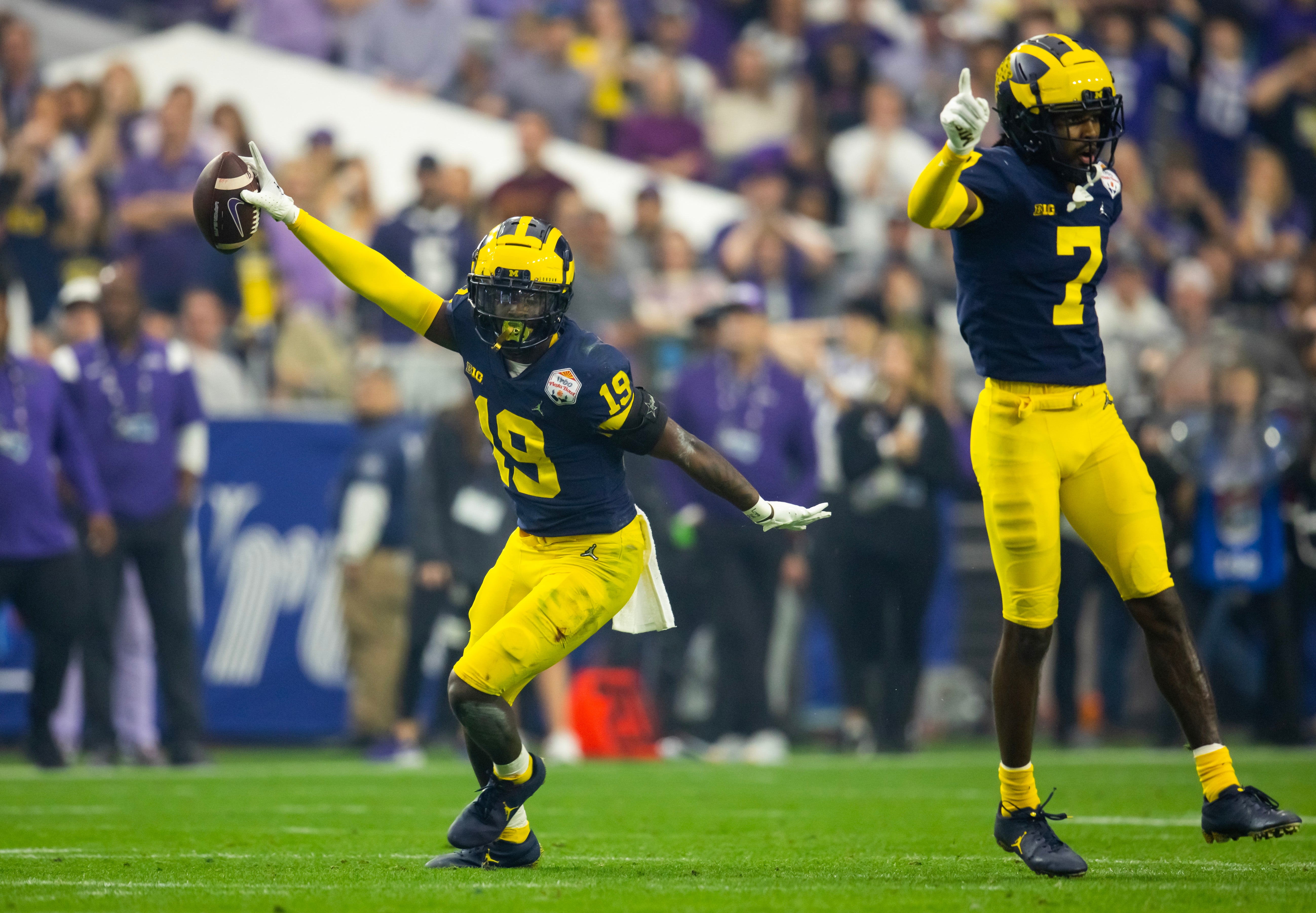 Dec 31, 2022; Glendale, Arizona, USA; Michigan Wolverines defensive back Rod Moore (19) celebrates an interception against the TCU Horned Frogs during the 2022 Fiesta Bowl at State Farm Stadium.