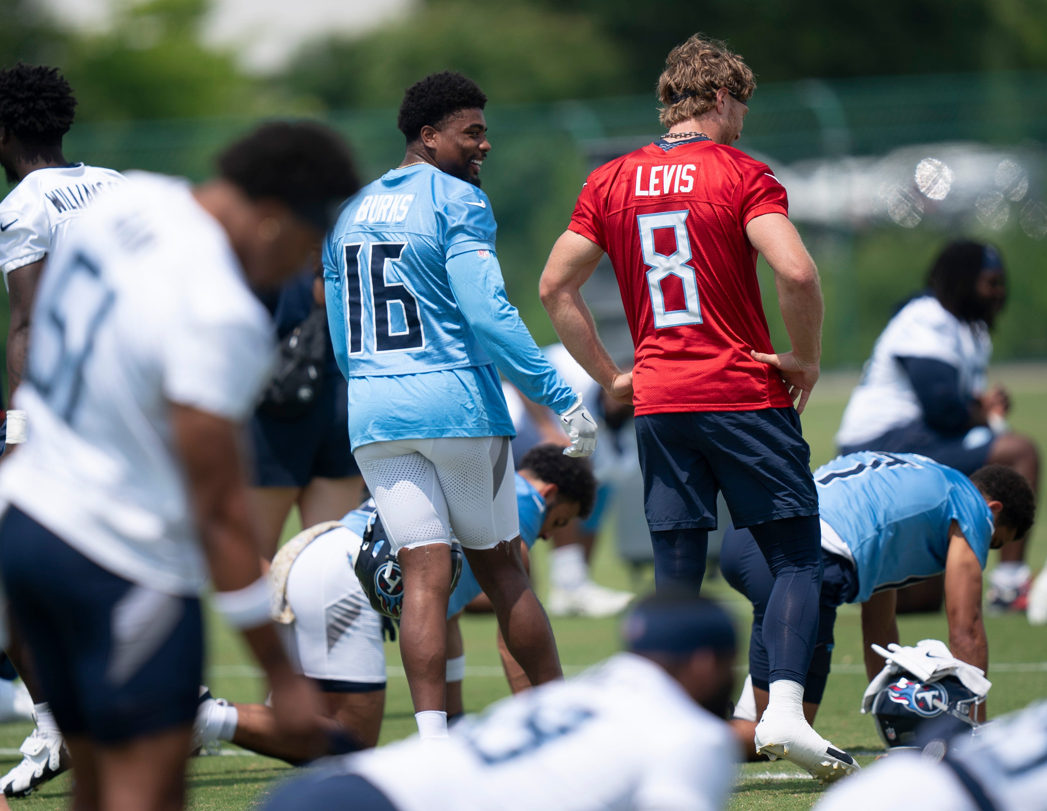 Tennessee Titans Treylon Burks (16) and Will Levis talk as stretching begins during OTAs at Ascension Saint Thomas Sports Park in Nashville, Tenn., Tuesday, June 3, 2025.