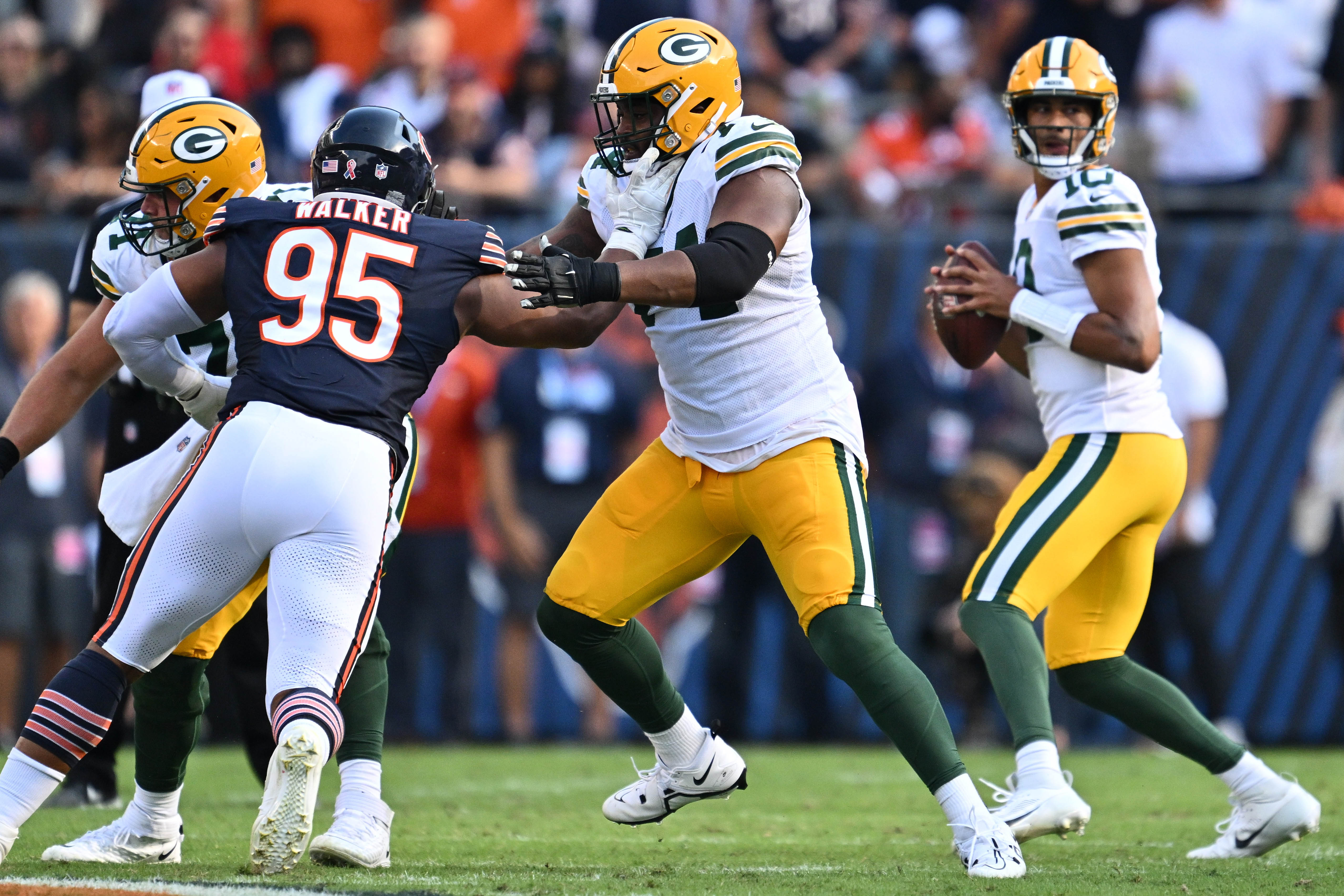 Green Bay Packers guard Elgton Jenkins (74) blocks against the Chicago Bears at Soldier Field. 