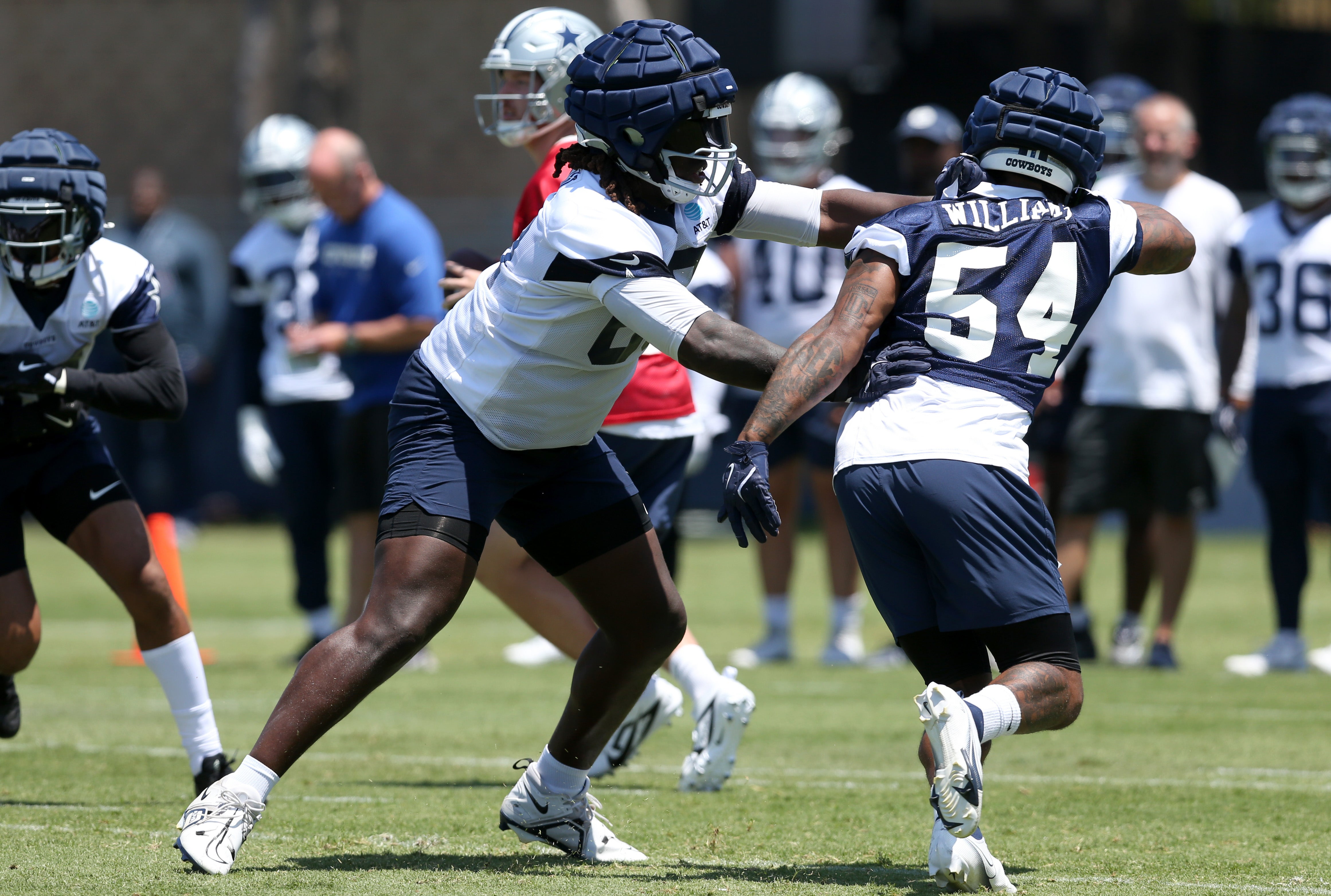Dallas Cowboys tackle Tyler Guyton (60) blocks during training camp at the River Ridge Playing Fields in Oxnard, Californian.