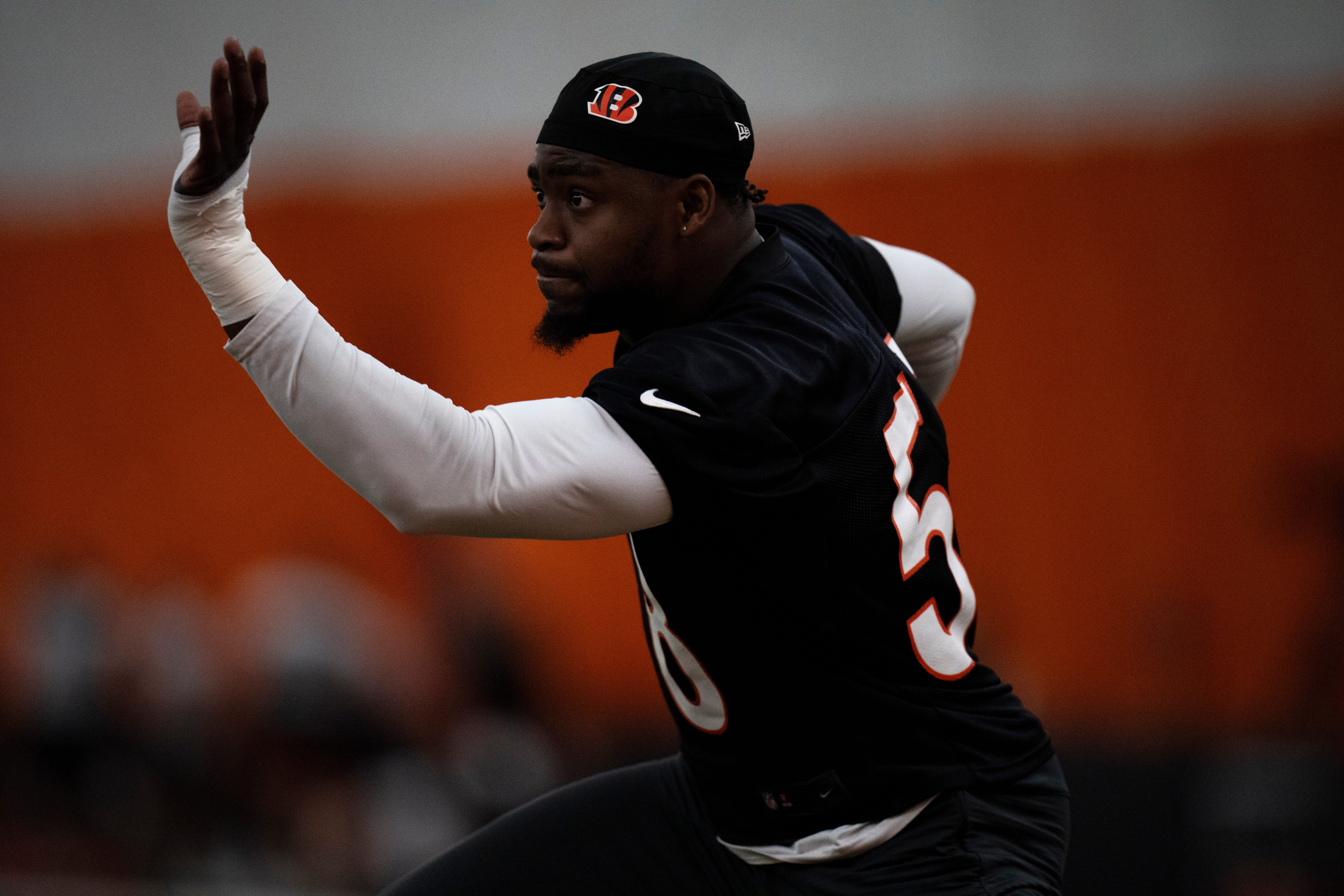Cincinnati Bengals defensive end Joseph Ossai (58) warms up at Bengals spring practice at the IEL Indoor Facility in Cincinnati on Wednesday, June 12, 2024.  