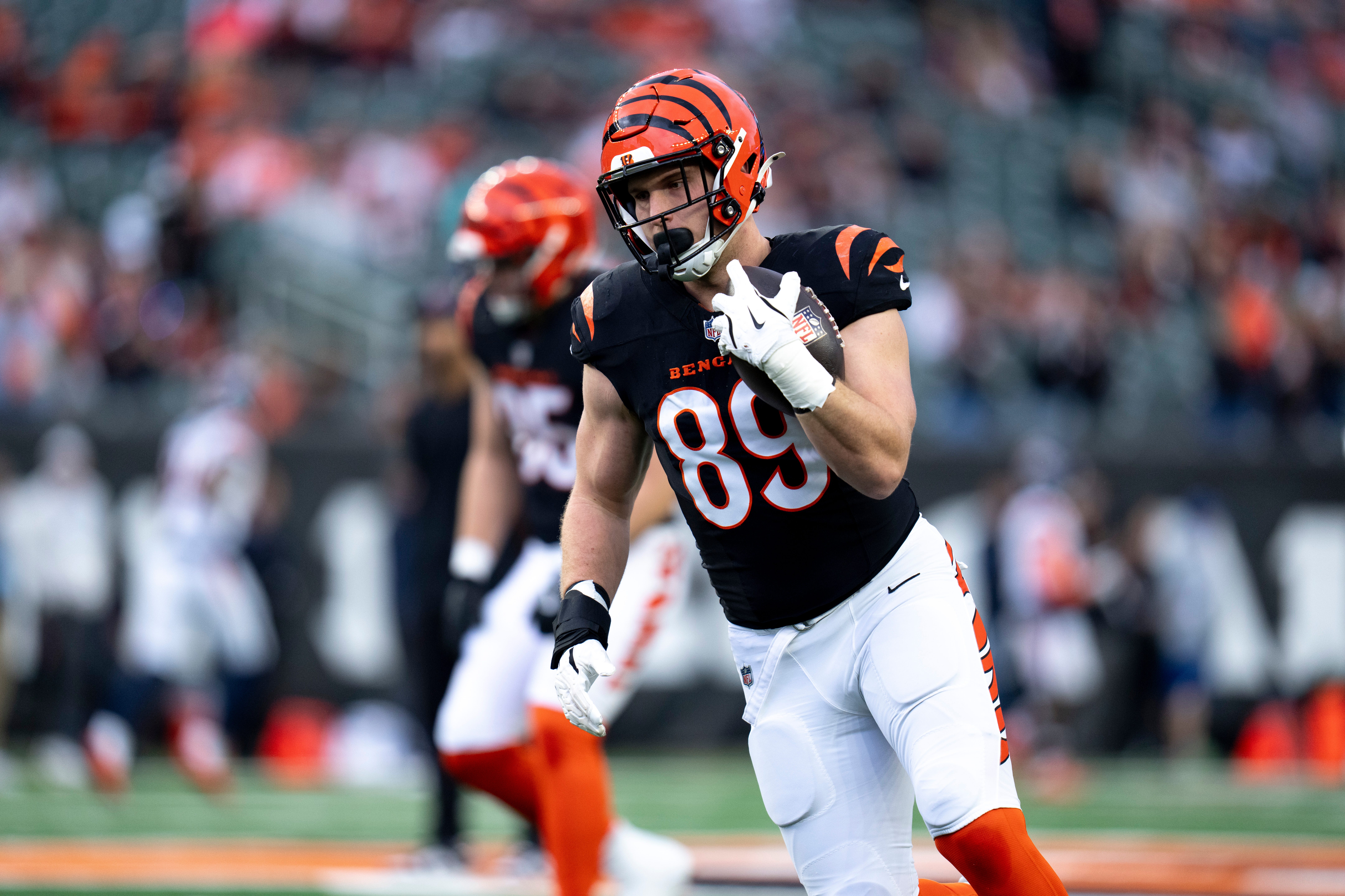 Cincinnati Bengals tight end Drew Sample (89) runs after a catch during warm ups before the NFL game between the Cincinnati Bengals and the Denver Broncos at Paycor Stadium in Cincinnati on Saturday, Dec. 28, 2024.  
