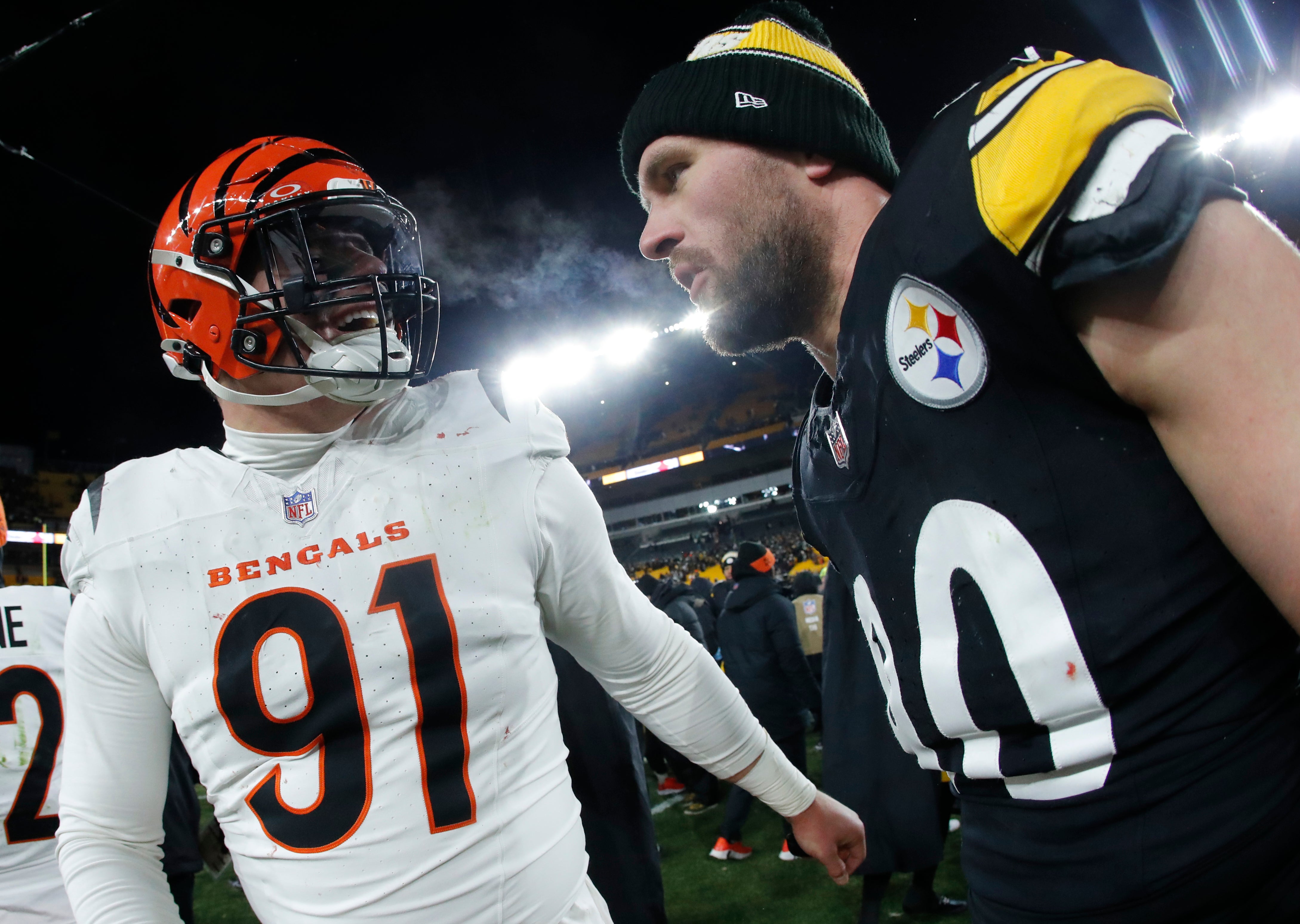 Jan 4, 2025; Pittsburgh, Pennsylvania, USA; Cincinnati Bengals defensive end Trey Hendrickson (91) and Pittsburgh Steelers linebacker T.J. Watt (90) talk after the game at Acrisure Stadium.