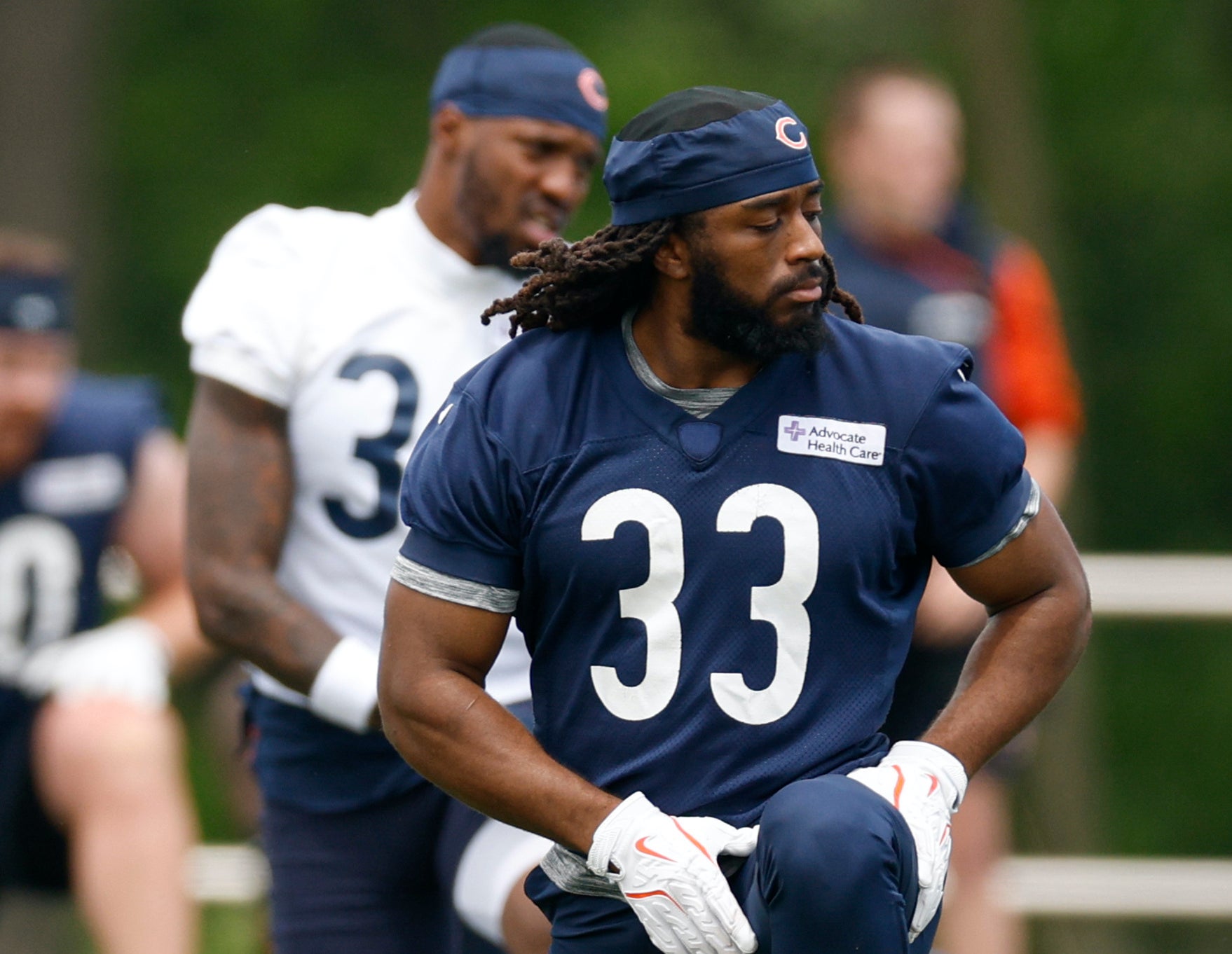 Ian Wheeler (33) warms up during minicamp at Halas Hall.