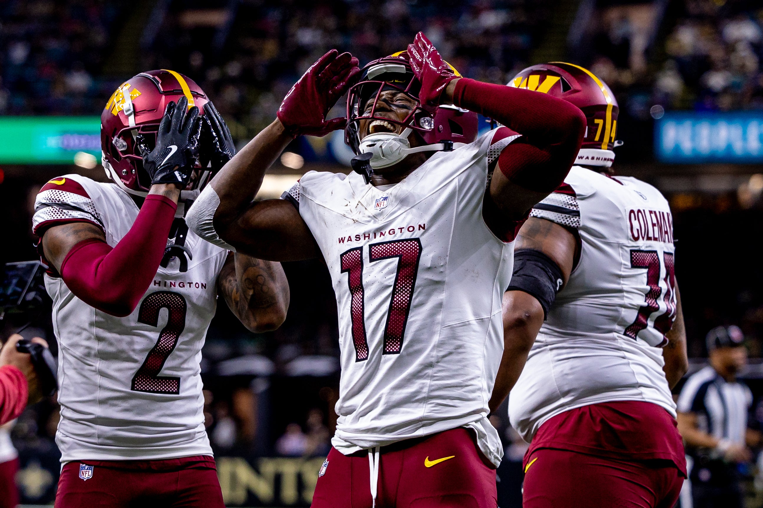 Dec 15, 2024; New Orleans, Louisiana, USA; Washington Commanders wide receiver Terry McLaurin (17) reacts to scoring a touchdown against the New Orleans Saints during the first half at Caesars Superdome.