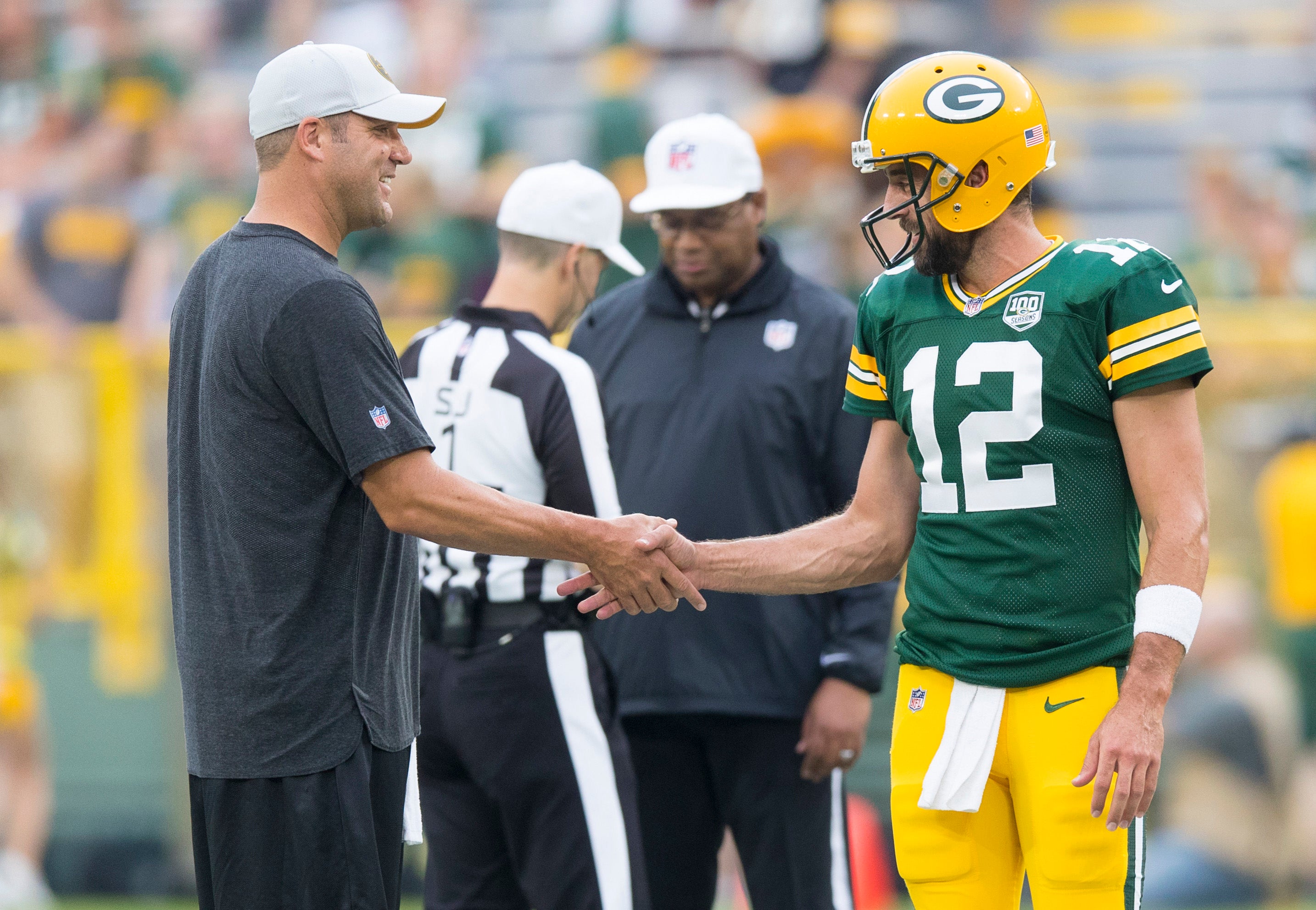 Aug 16, 2018; Green Bay, WI, USA; Pittsburgh Steelers quarterback Ben Roethlisberger greets Green Bay Packers quarterback Aaron Rodgers (12) during warmups prior to the game at Lambeau Field.