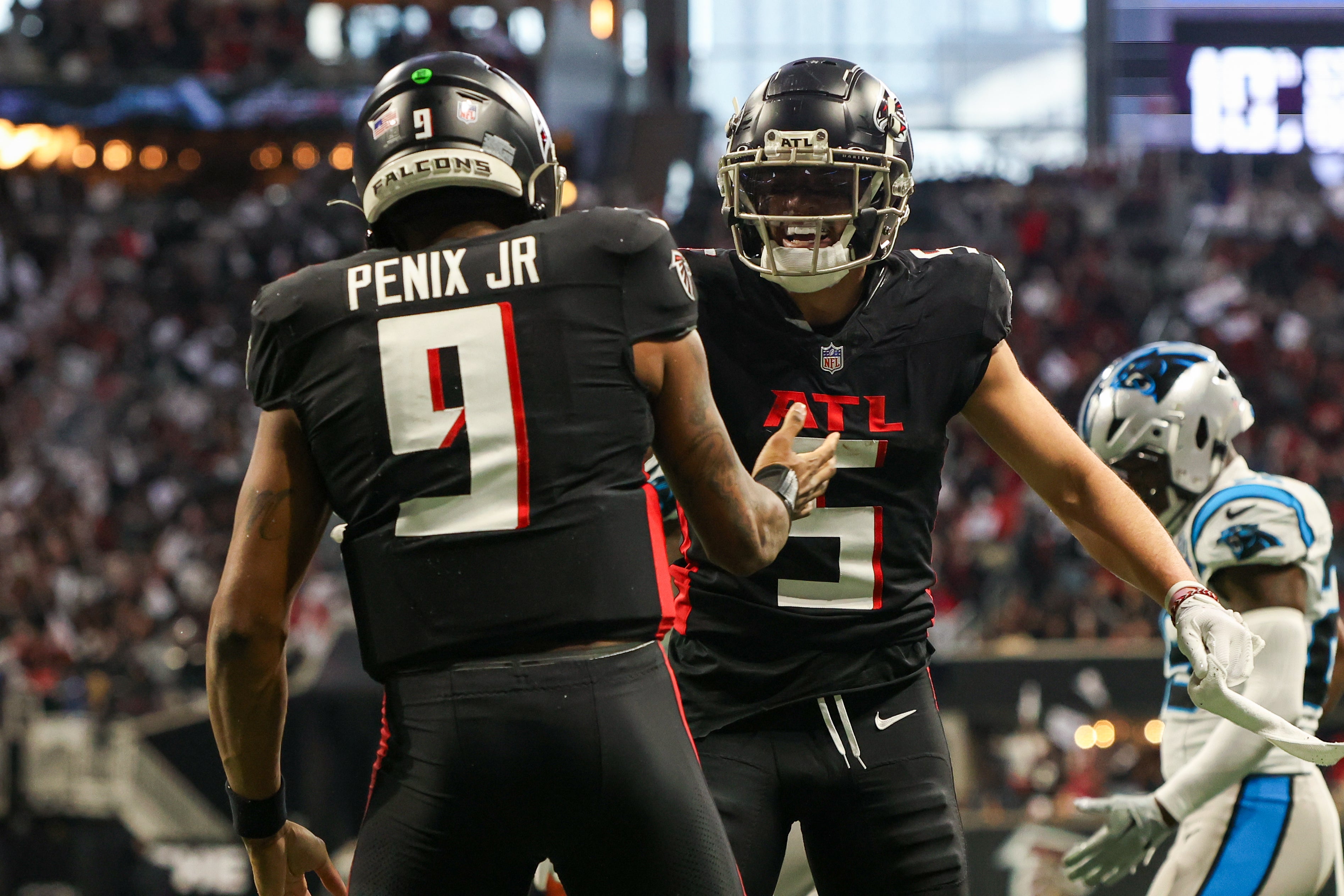 Atlanta Falcons QB Michael Penix Jr. celebrates with WR Drake London