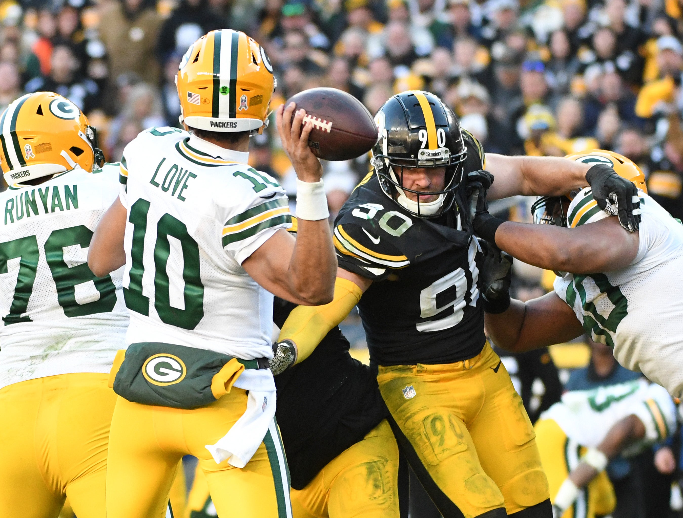 Green Bay Packers quarterback Jordan Love (10)is pressured by Pittsburgh Steelers linebacker T.J. Watt (90) during the fourth quarter at Acrisure Stadium.