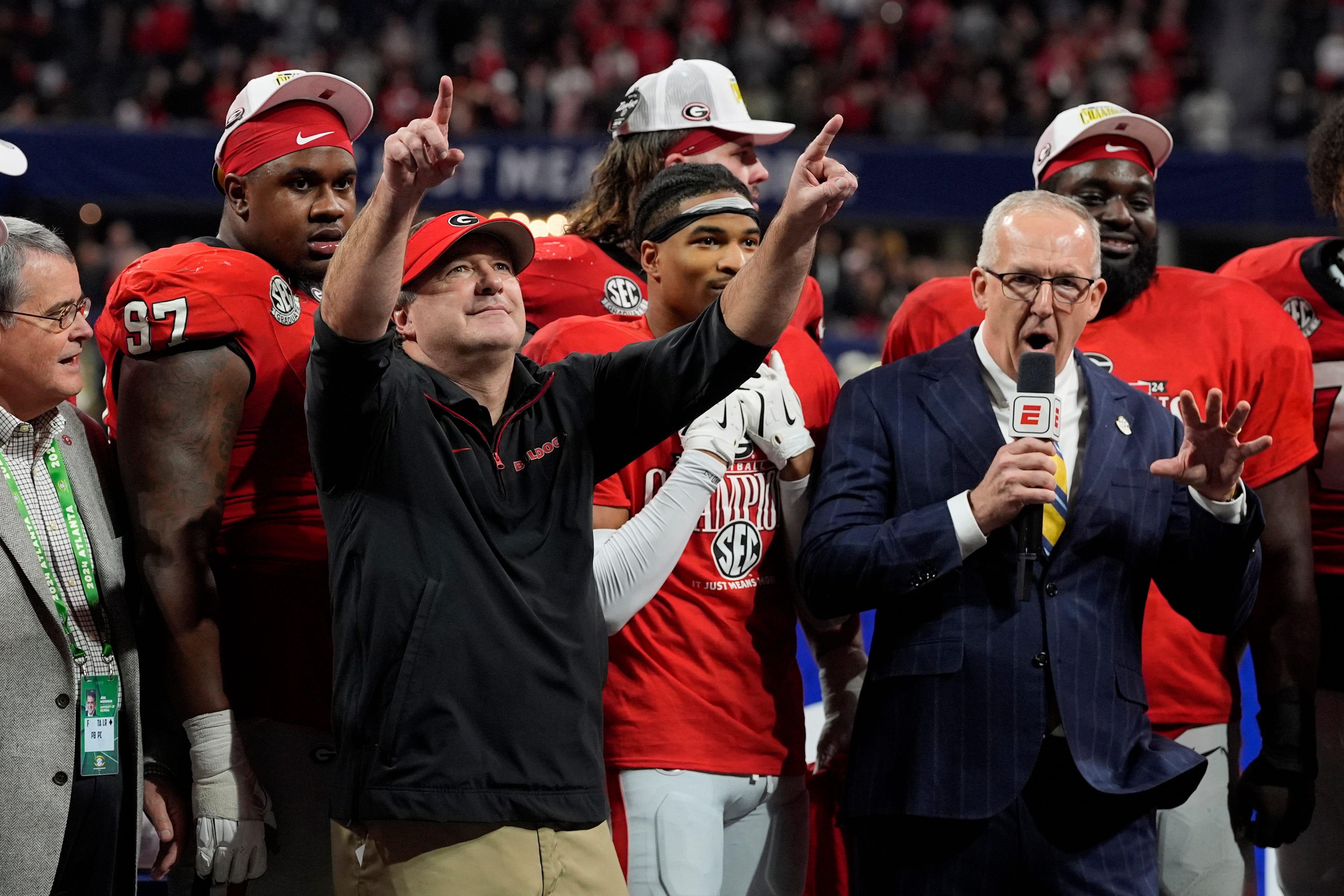 Georgia coach Kirby Smart celebrates with his team after the winning the SEC championship game against Texas in Atlanta, on Saturday, Dec. 7, 2024. Georgia won 22-19.
