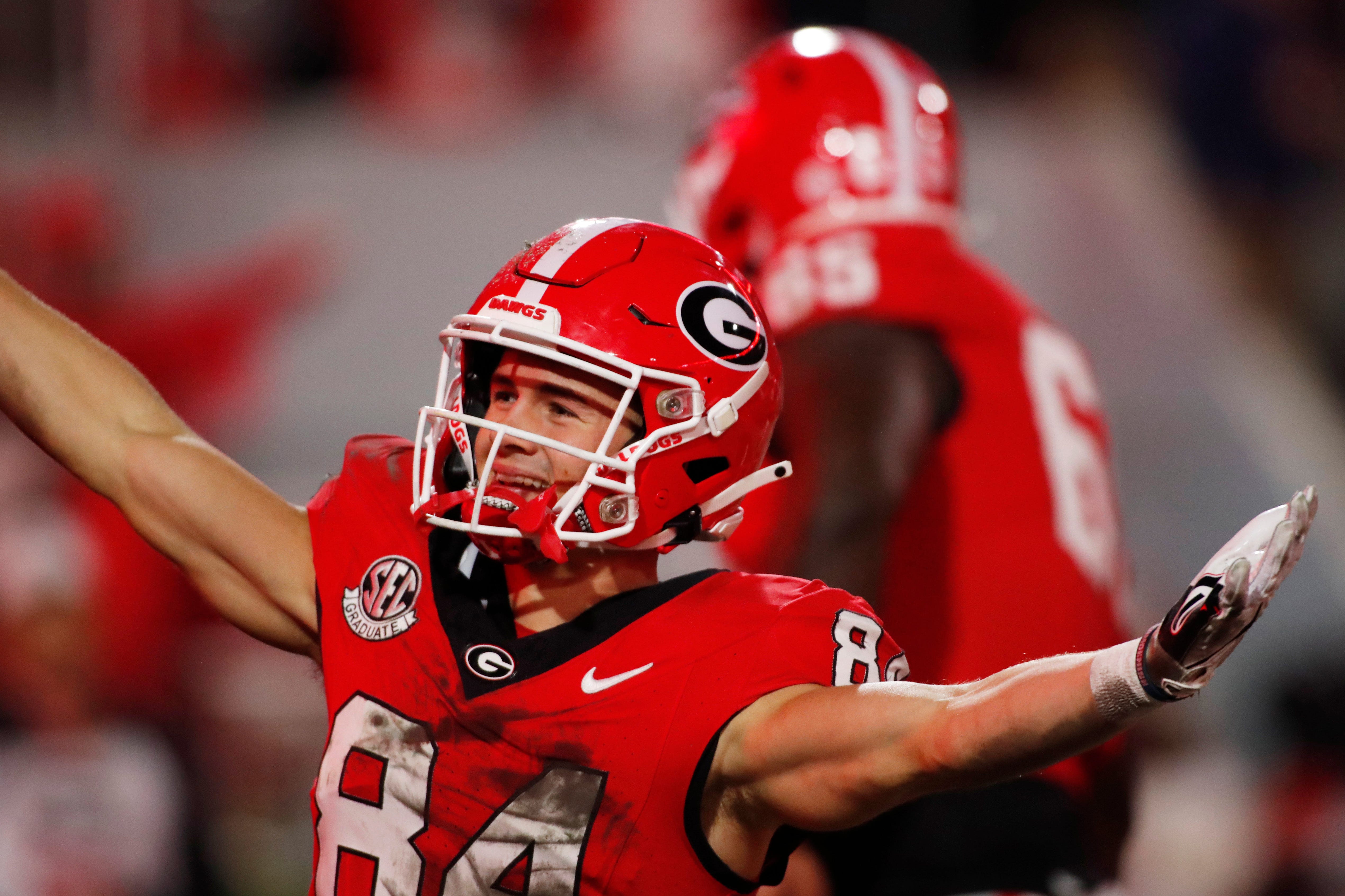 Georgia wide receiver Ladd McConkey (84) celebrate with his teammates after scoring a touchdown during the first half of a NCAA college football game against Ole Miss in Athens, Ga., on Saturday, Nov. 11, 2023.