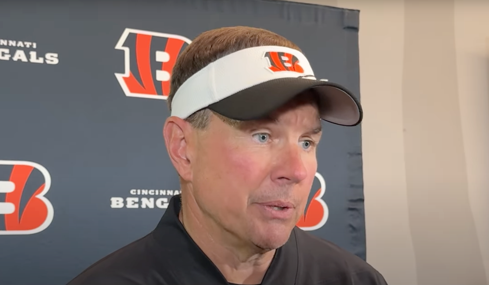 Cincinnati Bengals defensive coordinator Al Golden talks to reporters following a mandatory minicamp practice session on June 11, 2025.