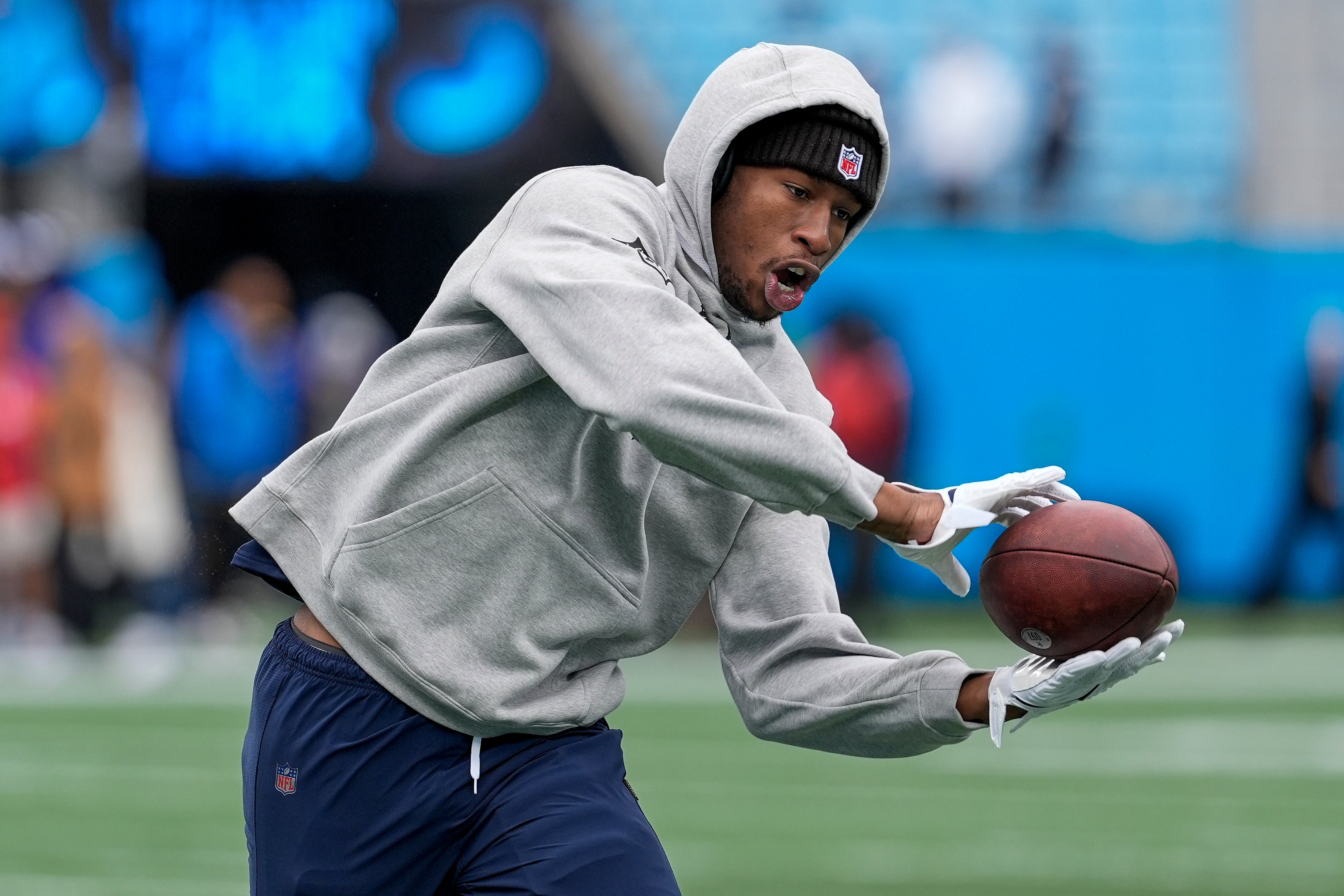 Dallas Cowboys safety Israel Mukuamu (24) makes a catch during pregame warmups against the Carolina Panthers at Bank of America Stadium.