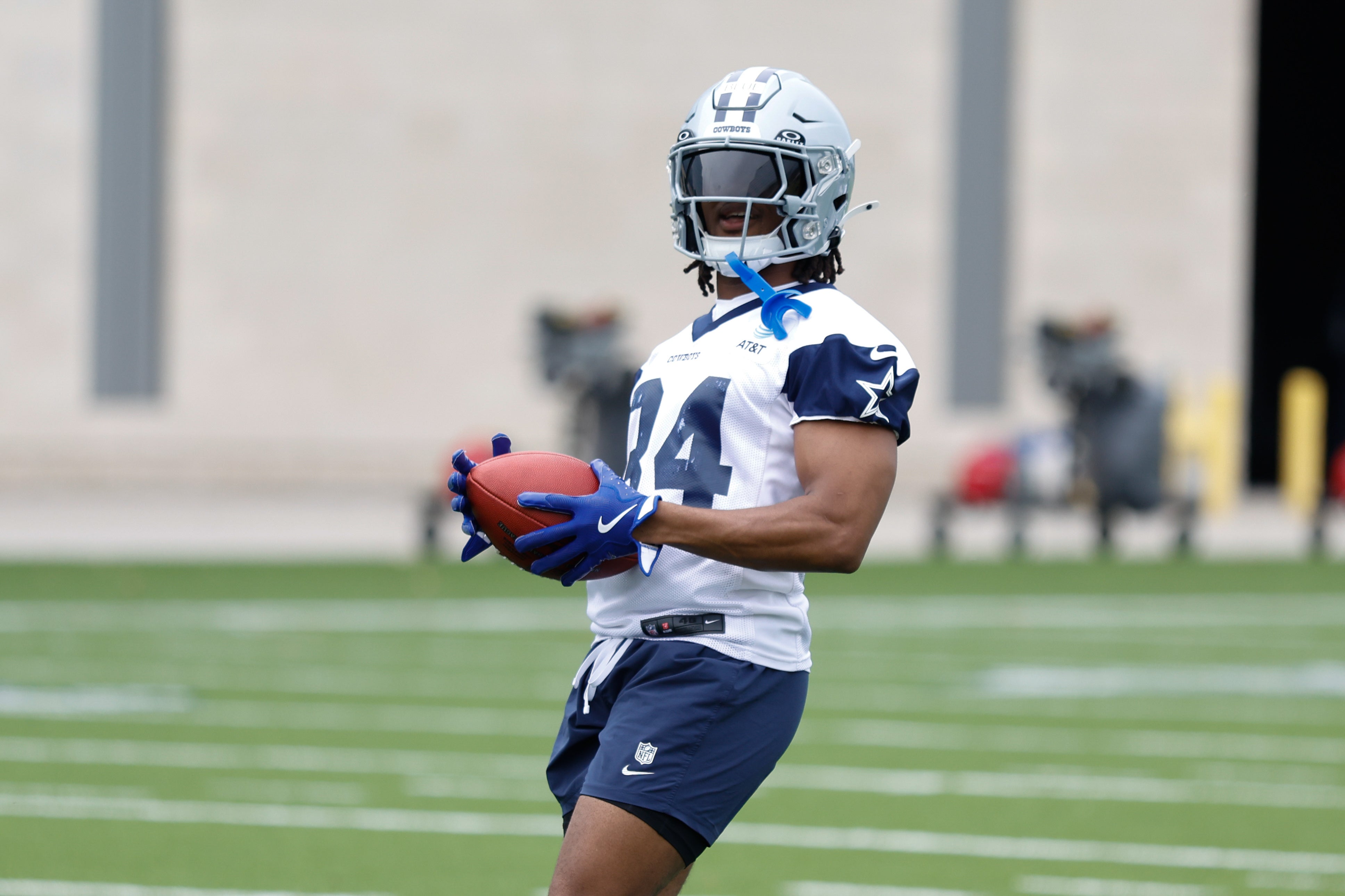 Dallas Cowboys running back Jaydon Blue (34) goes through a drill during practice at the Ford Center at the Star Training Facility in Frisco, Texas.