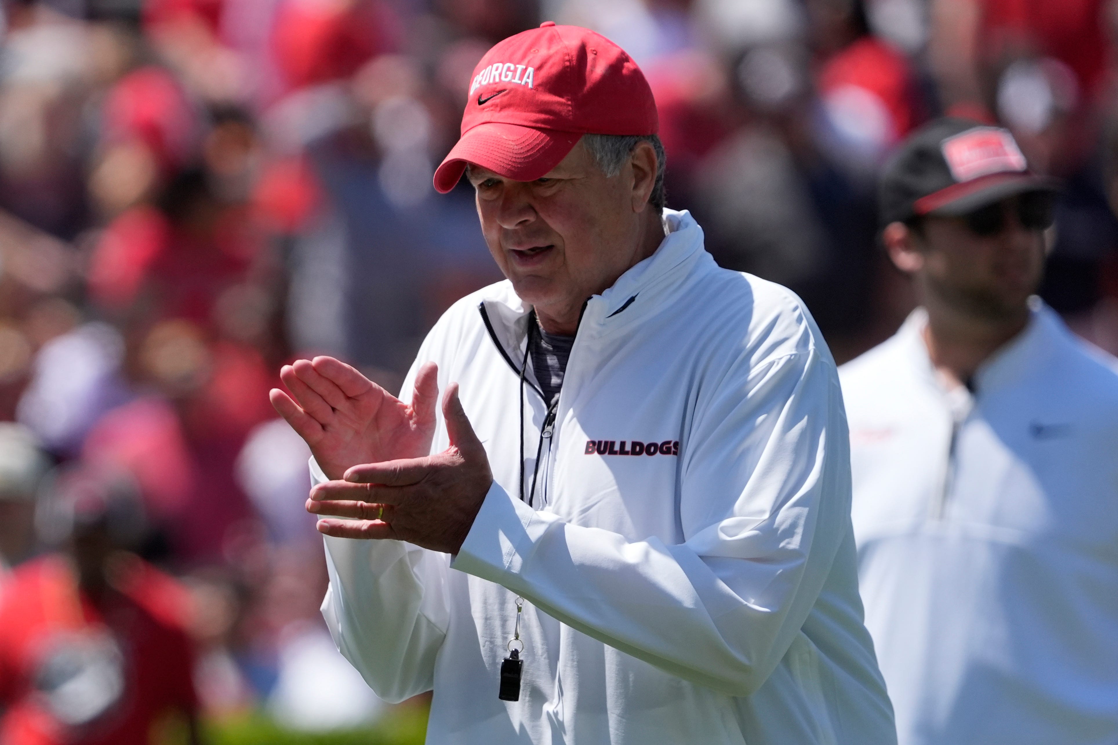 Georgia assistant coach and offensive line coach Stacy Searels works with his unit during warm ups before the start of the Georgia G-Day spring football game in Athens, Ga., on Saturday, April 12, 2025.